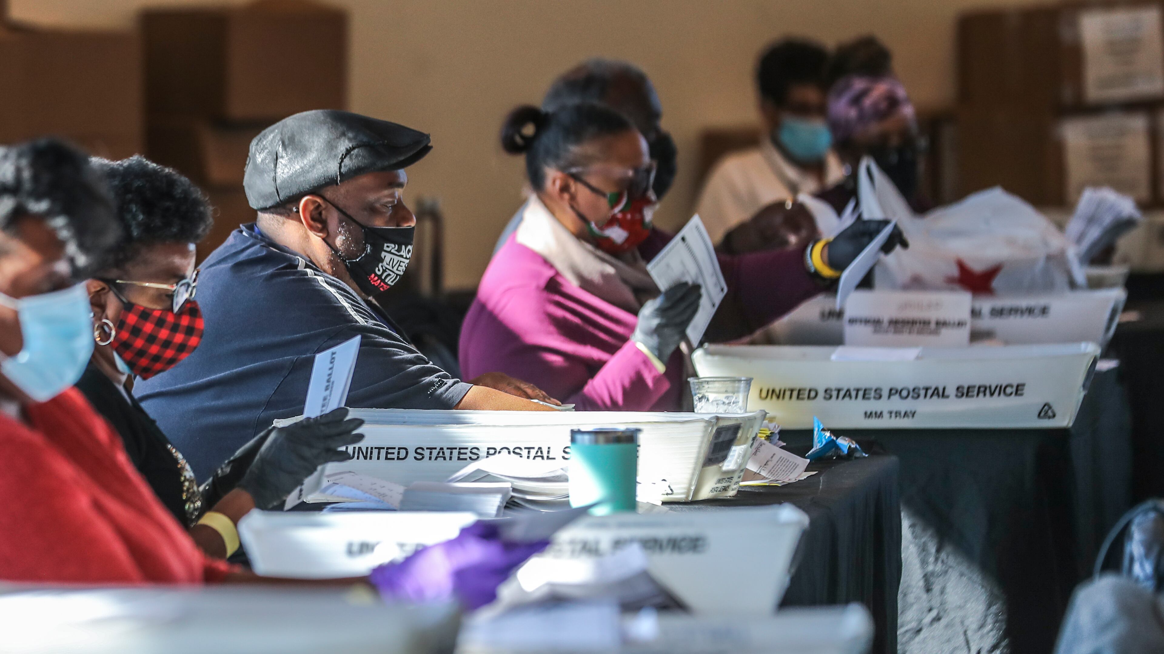 Fulton County election workers started counting and scanning ballots again Wednesday as the state and nation waited for the results. (John Spink / John.Spink@ajc.com)