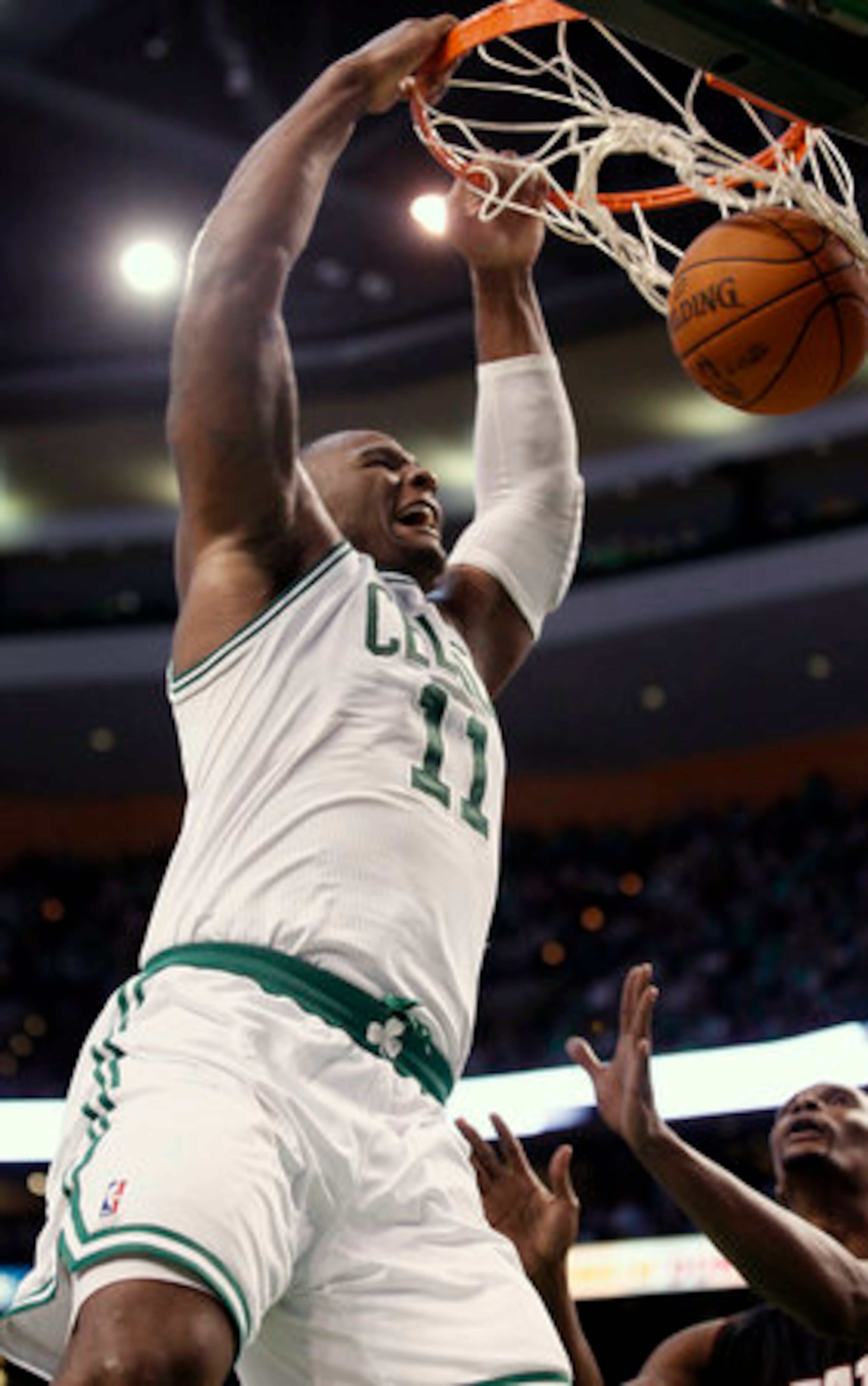 Glen "Big Baby" Davis dunks over Bosh. The bench player, who had 13 points, was one of four Celtics in double figures. Allen had 20 points, Pierce finished with 19 and Garnett had 10 points and 10 rebounds.