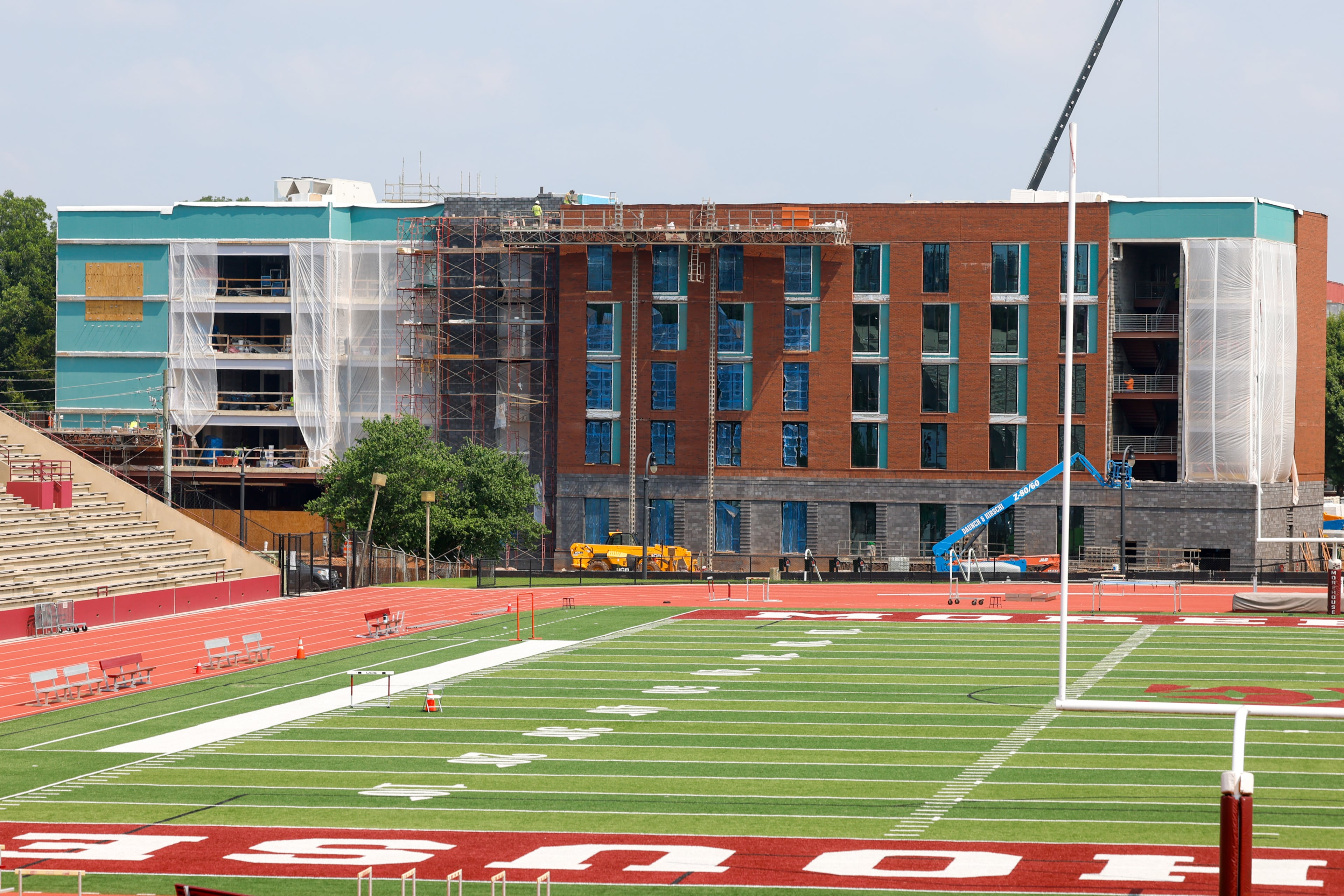 Workers construct a new residence hall on Morehouse College’s campus in Atlanta on July 30, 2026. (Arvin Temkar/AJC)