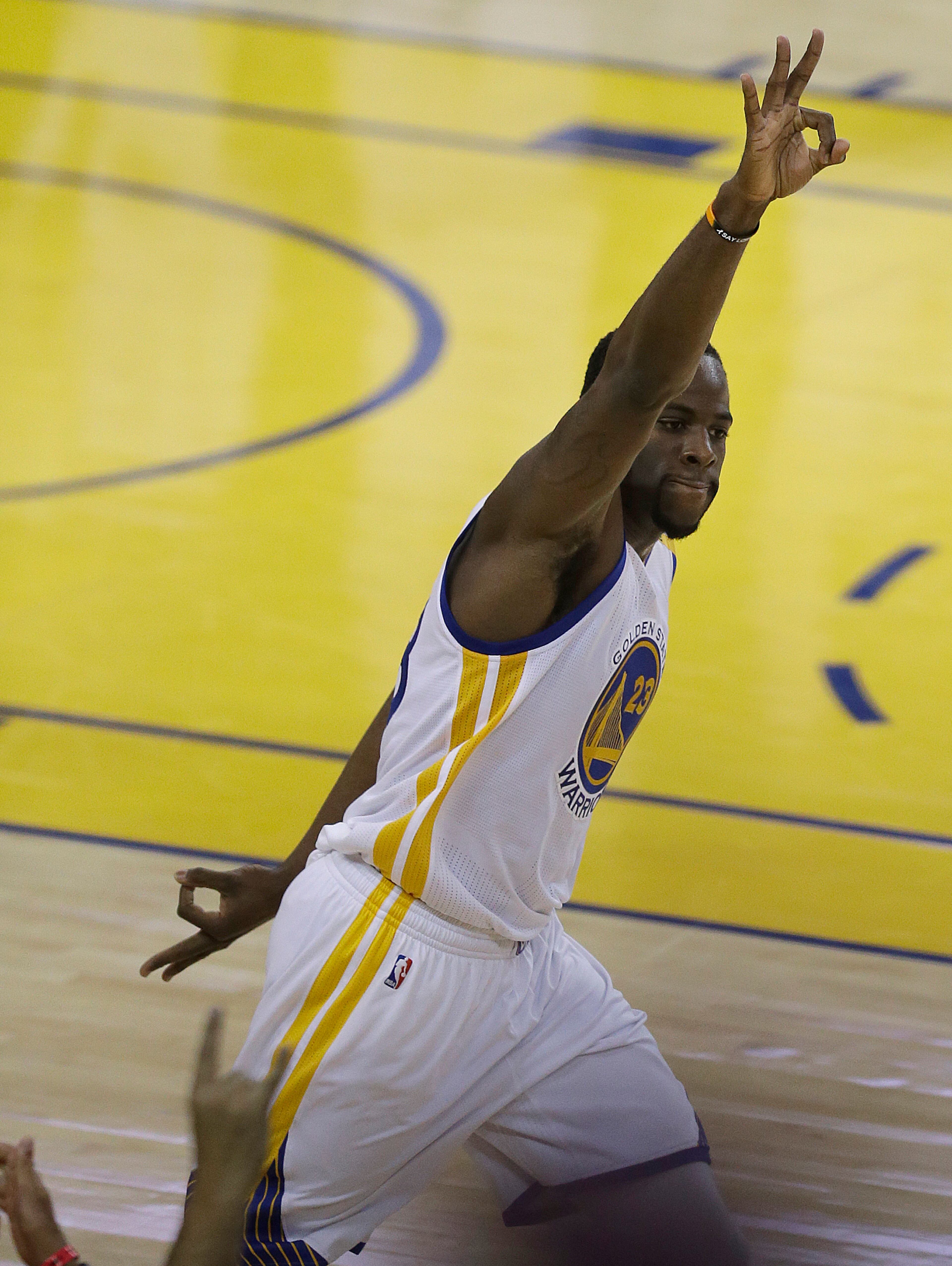 Golden State Warriors forward Draymond Green (23) gestures after scoring against the Cleveland Cavaliers during the first half of Game 5 of basketball's NBA Finals in Oakland, Calif., Monday, June 12, 2017. (AP Photo/Ben Margot)