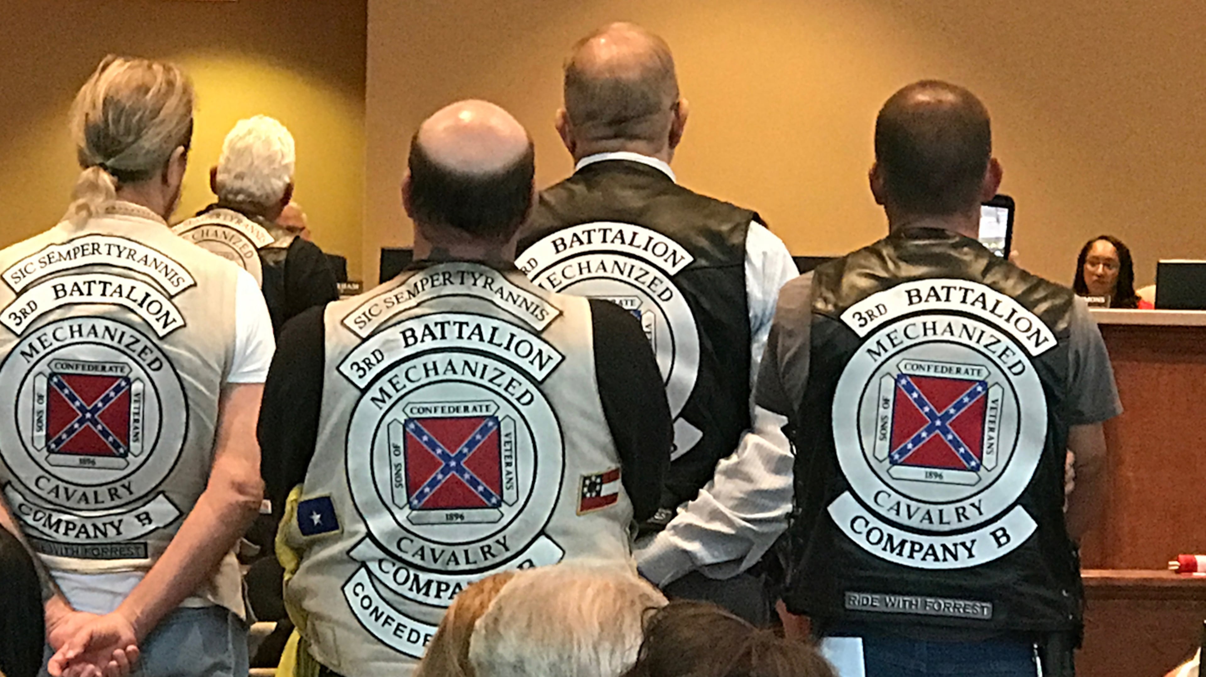 Members of the Sons of Confederate Veterans at the commission meeting Tuesday. Commissioner Dee Clemmons, the object of their ire, is at right. (Rosalind Bentley / rbentley@ajc.com)