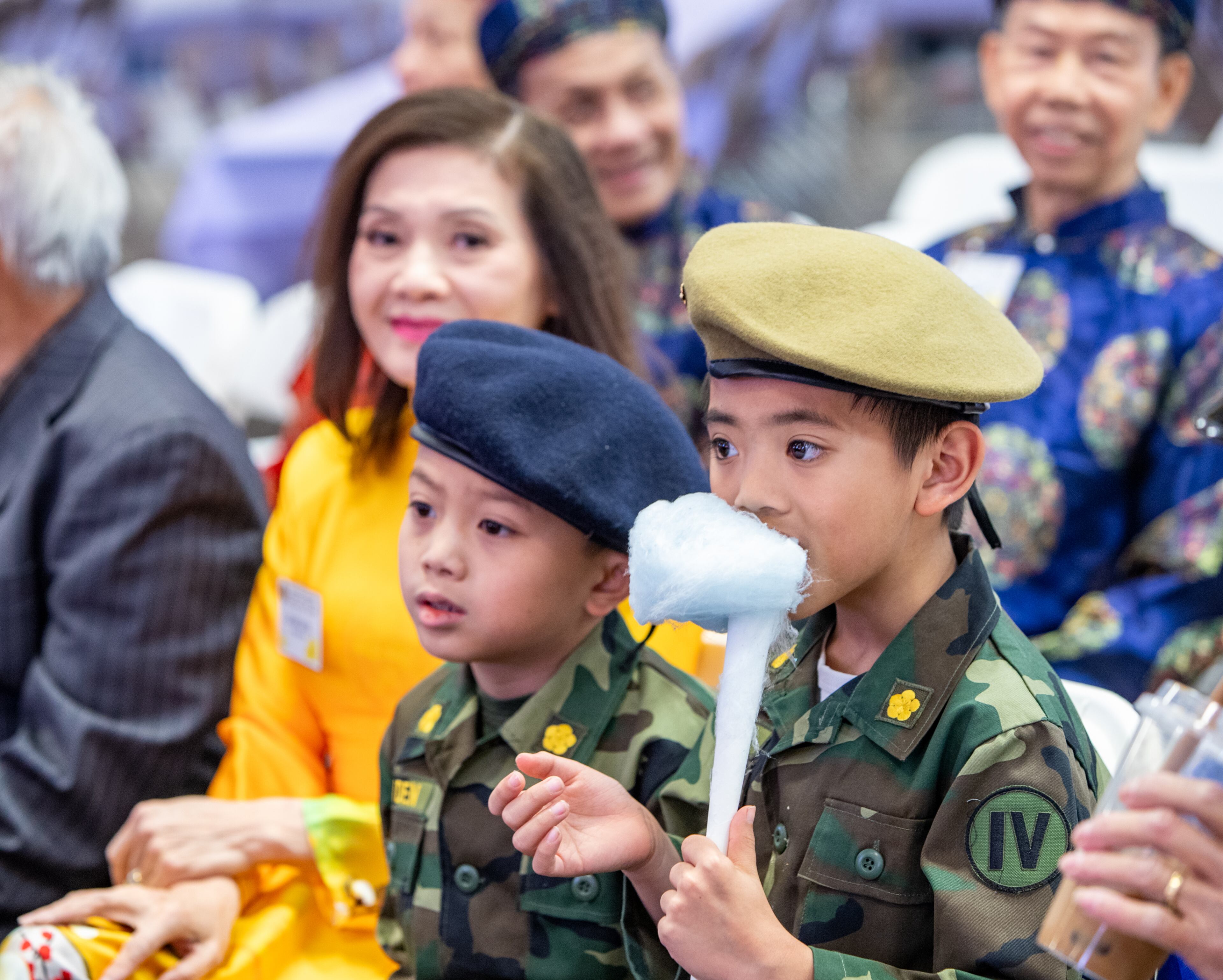 Enjoying the show, Thien-an Pham, with cotton candy, and Aiden Nguyen, both 7, have great seats for the lion dance on Saturday, Feb 3, 2024. The Vietnamese American Community of Georgia hosts a Lunar New Year celebration at Plaza Las Americas in Lilburn on Saturday, Feb 3, 2024 where dragon and lion dancing begins the weekend. The celebration continues on Sunday and includes traditional food, music and cultural festivities. (Jenni Girtman for The Atlanta Journal-Constitution)