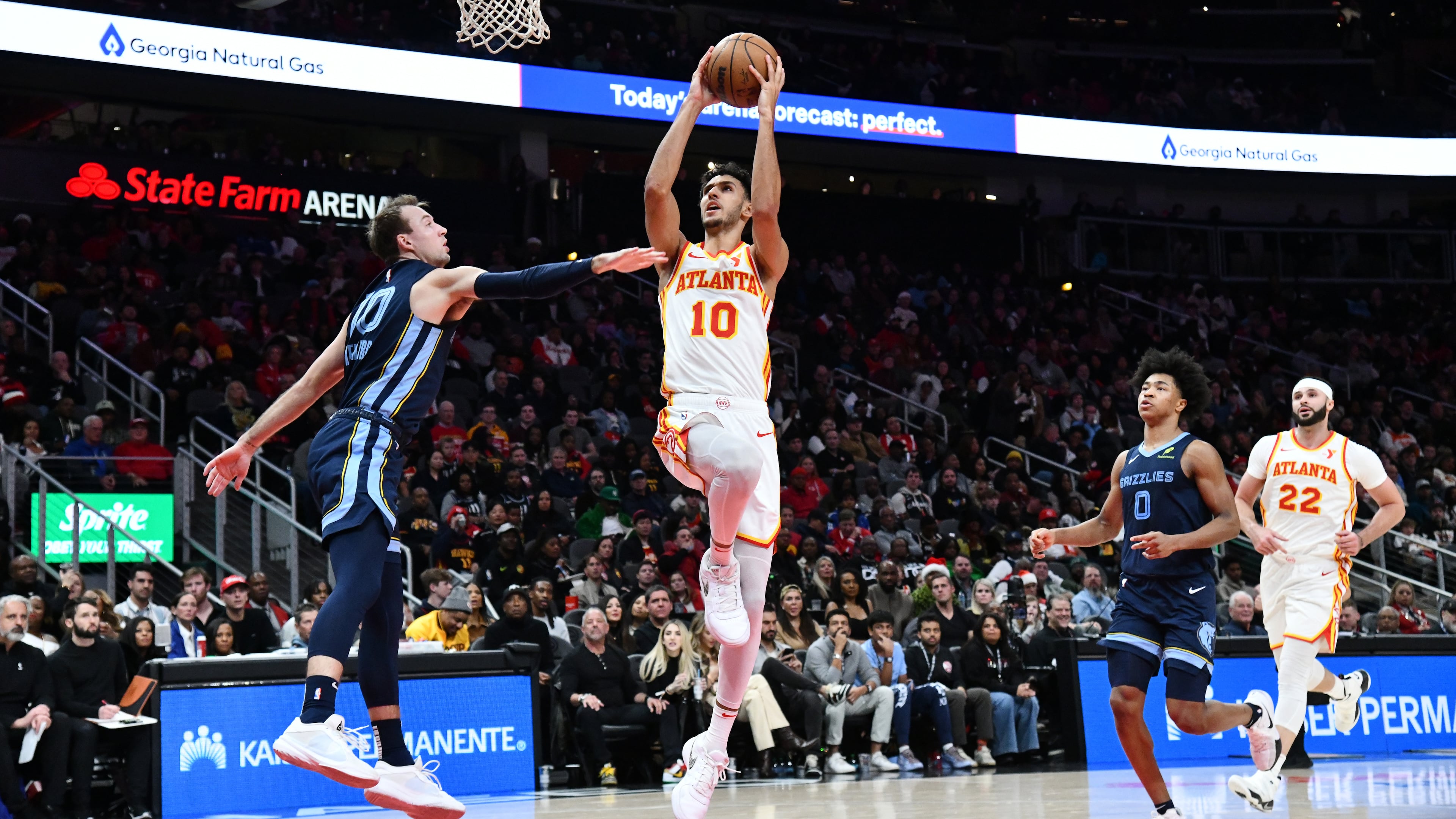 Atlanta Hawks forward Zaccharie Risacher goes up for a shot against Memphis Grizzlies guard Luke Kennard during a game at State Farm Arena on Saturday, Dec. 21, 2024. (Hyosub Shin/AJC)