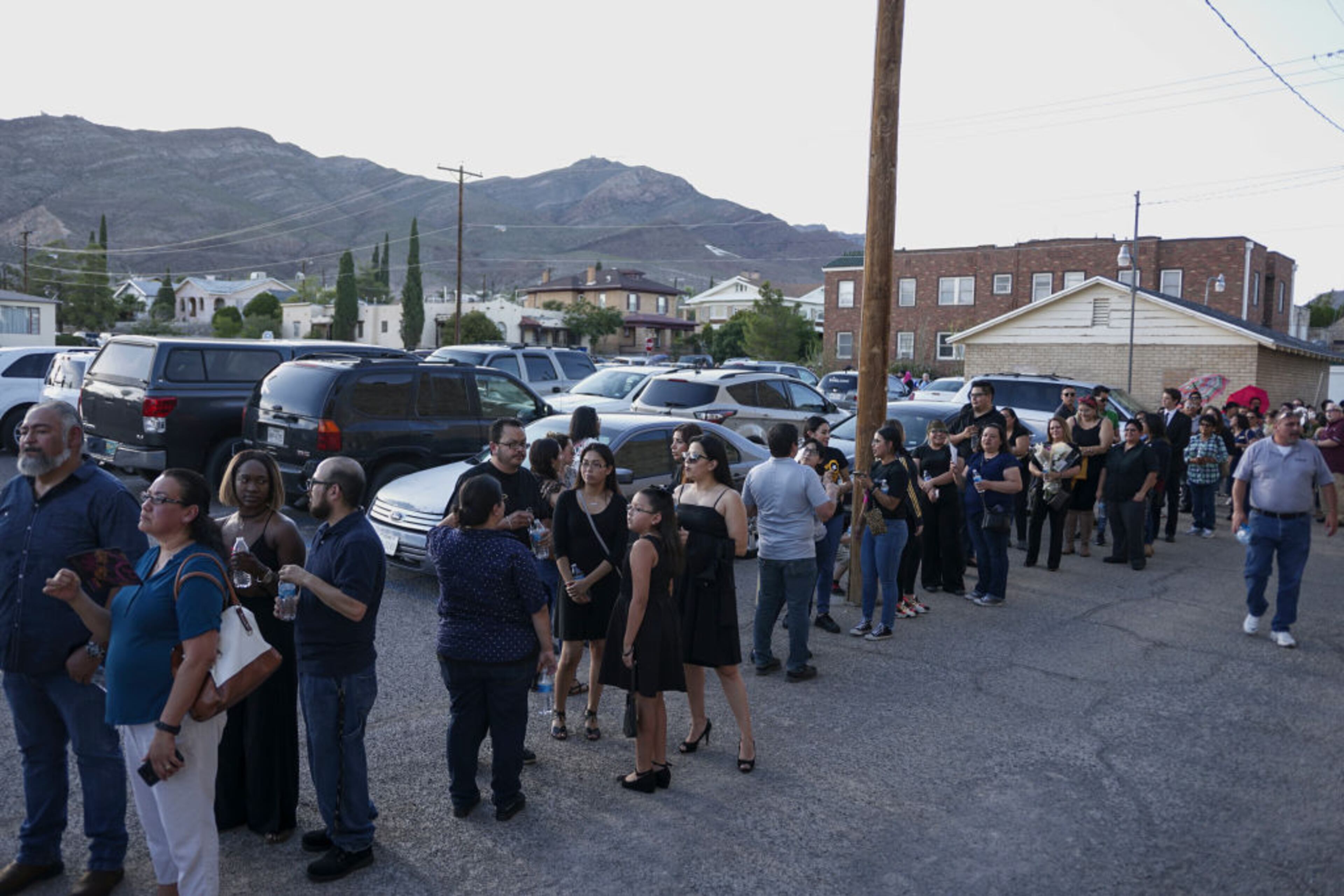 EL PASO, TX - AUGUST 16: Well wishers stand in line to pay tribute during a public memorial for Margie Reckard on August 16, 2019 in El Paso, Texas. Reckard was one of 22 killed during the Walmart shooting in El Paso on August 3rd. Her husband, Antonio Basco invited the public to attend the memorial in her honor and has laid fresh flowers everyday since the shooting at a make-shift memorial outside the outlet.(Photo by Sandy Huffaker/Getty Images)