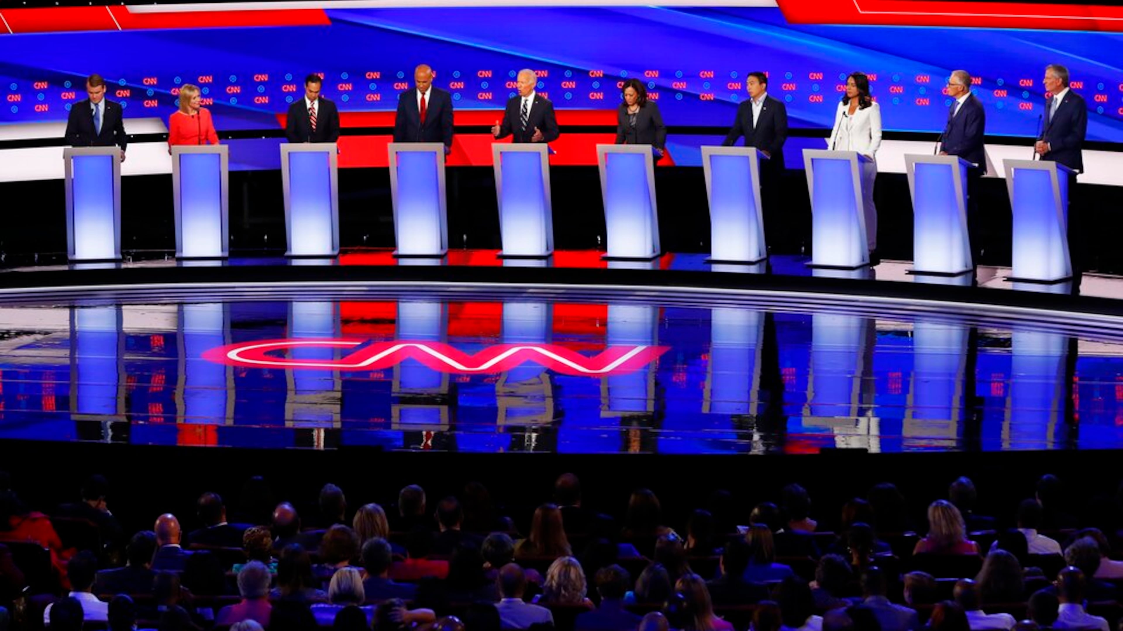 From left, Sen. Michael Bennet, D-Colo., Sen. Kirsten Gillibrand, D-N.Y., former Housing and Urban Development Secretary Julian Castro, Sen. Cory Booker, D-N.J., former Vice President Joe Biden, Sen. Kamala Harris, D-Calif., Andrew Yang, Rep. Tulsi Gabbard, D-Hawaii, Washington Gov. Jay Inslee and New York City Mayor Bill de Blasio participate in the second of two Democratic presidential primary debates hosted by CNN Wednesday, July 31, 2019, in the Fox Theatre in Detroit. (AP Photo/Paul Sancya)