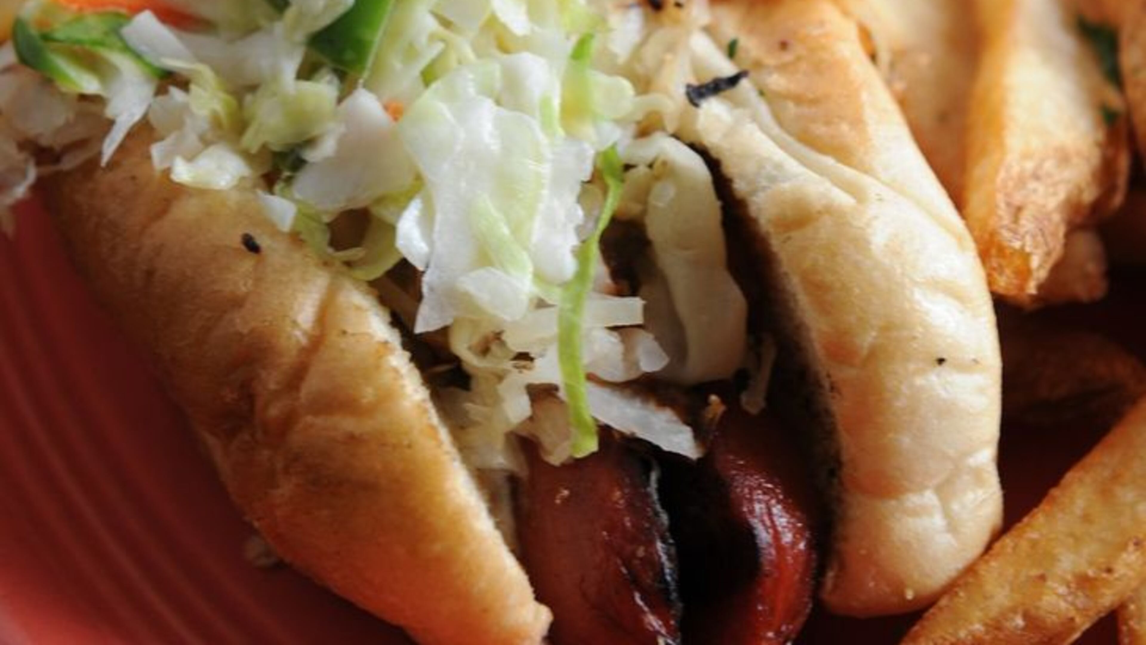 The Loaded Dogzilla features a half-pound all-beef hot dog topped with chili, cheese, kraut, onion, relish and slaw. (BECKYSTEIN.COM)