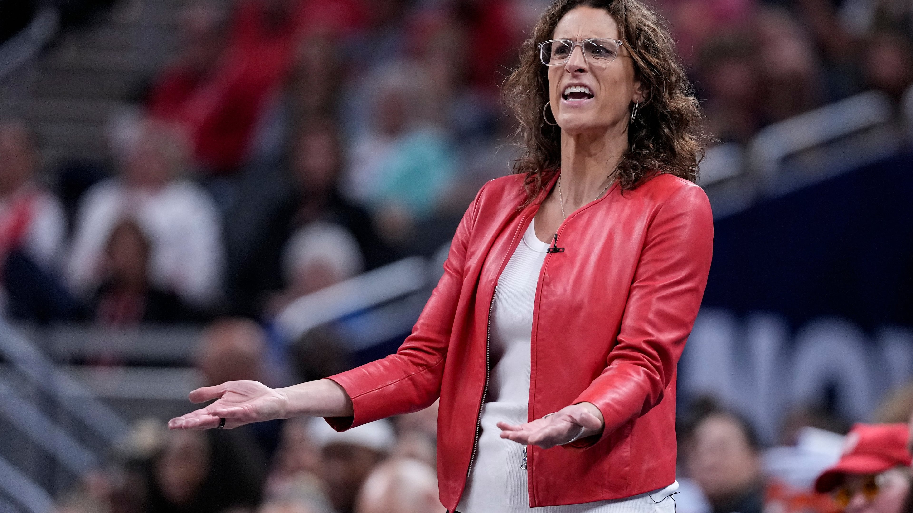 Indiana Fever head coach Stephanie White questions a call in the second half of a WNBA basketball game against the New York Liberty in Indianapolis, Tuesday, Aug. 11, 2026. (AP Photo/Michael Conroy)