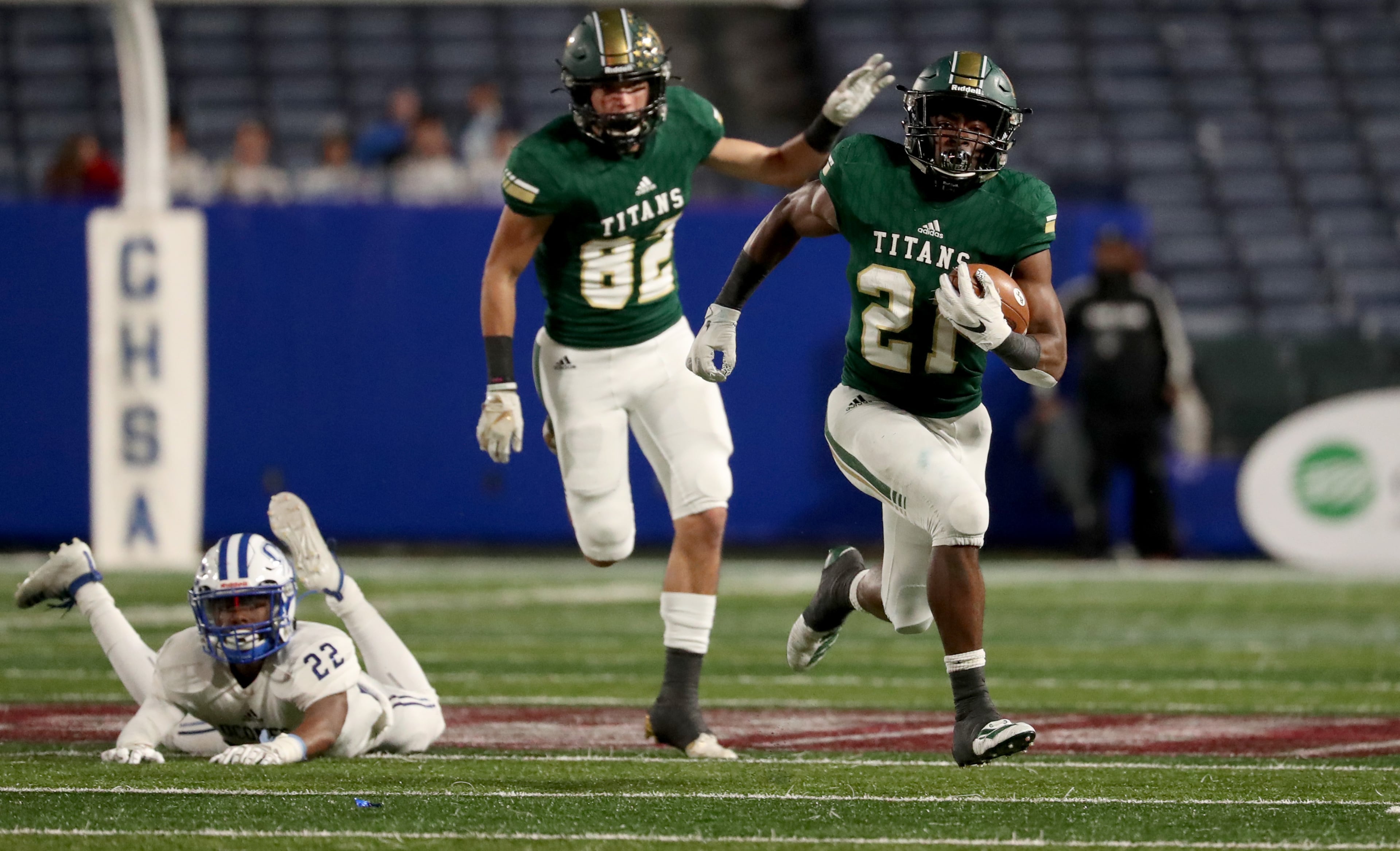 Blessed Trinity running back Elijah Green (21) gets by Oconee County defensive back Darius Johnson Jr. (22) for Green's second touchdown in the first half of the Class AAAA high school football state title at Georgia State Stadium Saturday, December 14, 2019 in Atlanta. Also shown on the play is Blessed Trinity wide receiver Justin Cellilli (82). (JASON GETZ/SPECIAL TO THE AJC)