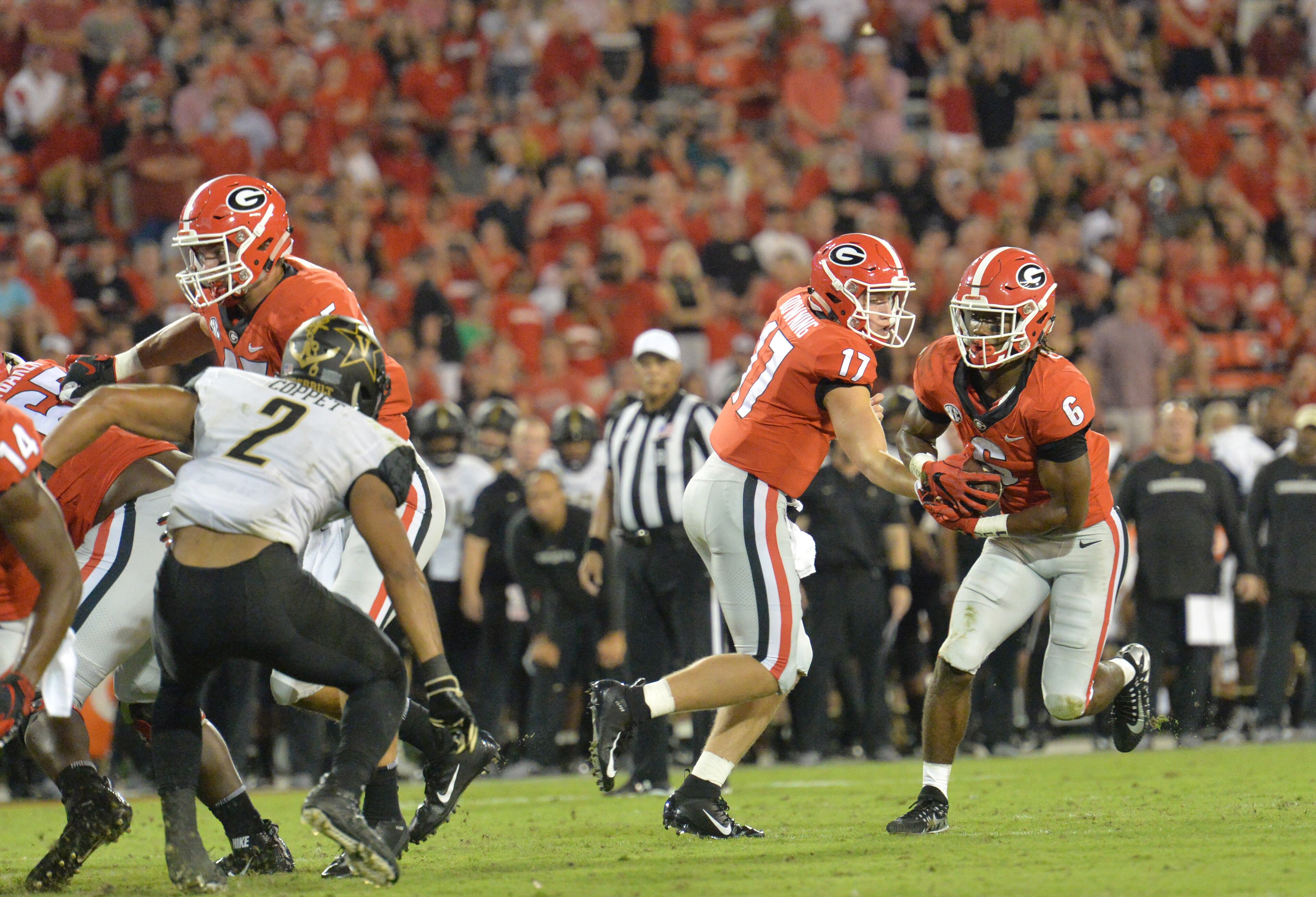 October 6, 2018 Athens - Georgia quarterback Matthew Downing (17) gets off a pass to Georgia running back James Cook (6) in the second half during a NCAA college football game at Sanford Stadium in Athens on Saturday, October 6, 2018. Georgia won 41-13 over the Vanderbilt. HYOSUB SHIN / HSHIN@AJC.COM