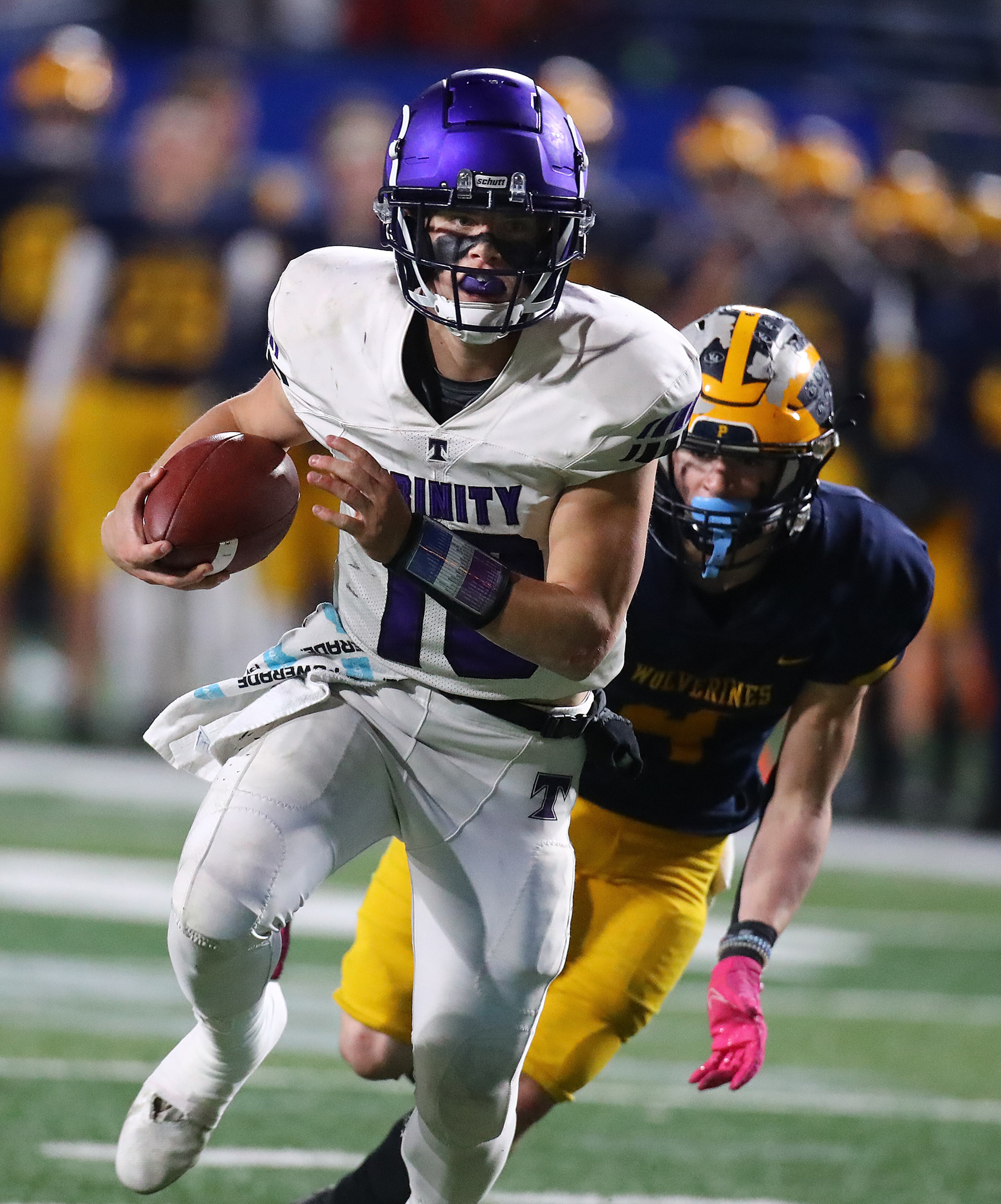 Trinity Christian quarterback David Dallas takes it to the house on a quarterback keeper for a 49-28 lead over Prince Avenue Christian during the 4th quarter in their GHSA Class A Private Championship game on Thursday, Dec 9, 2021, in Atlanta. “Curtis Compton / Curtis.Compton@ajc.com”`
