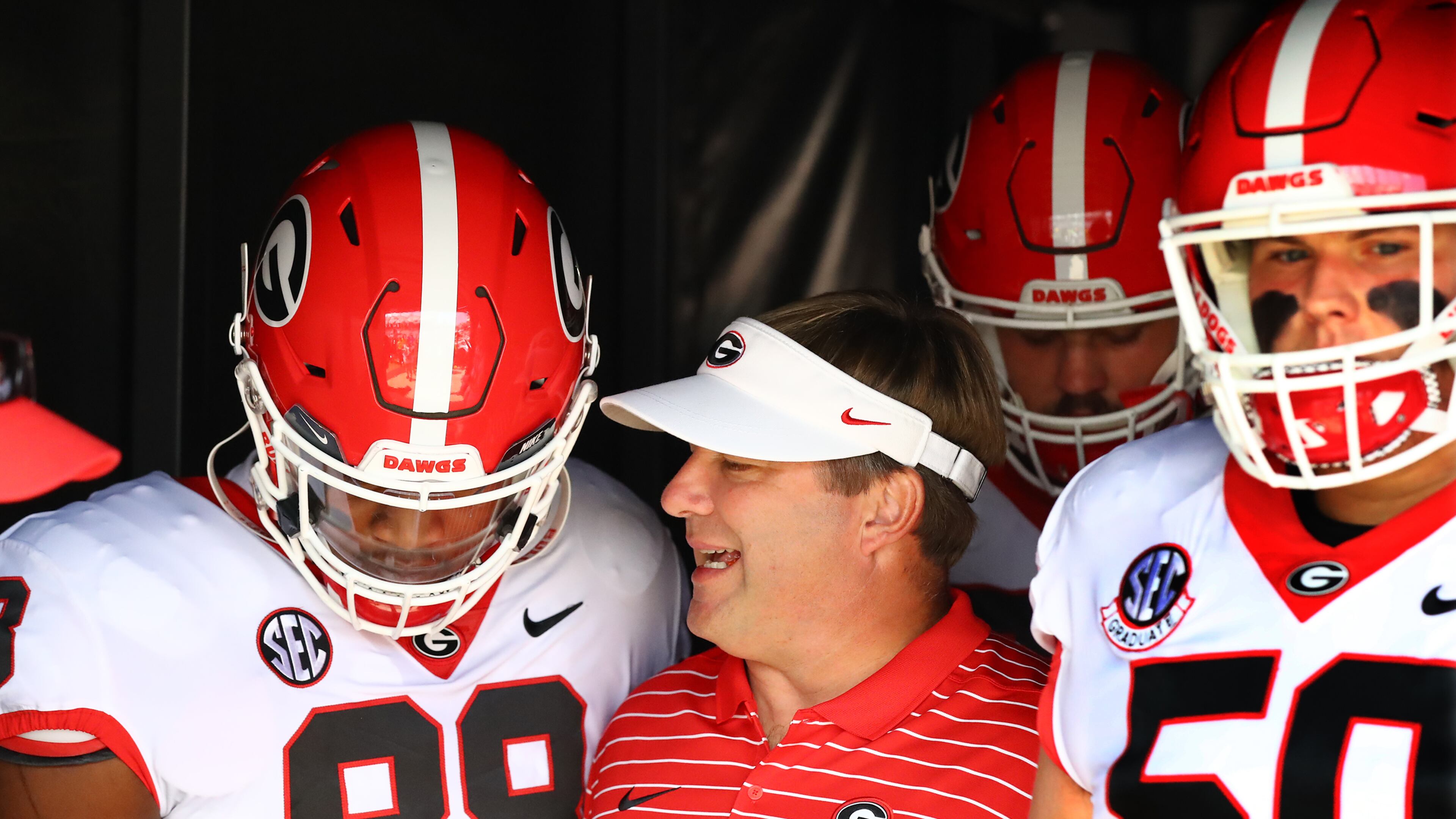 Georgia coach Kirby Smart confers with tight end Jesse Sanders while taking the field to play South Carolina in a NCAA college football game on Saturday, Sept. 17, 2022, in Columbia. “Curtis Compton / Curtis Compton@ajc.com