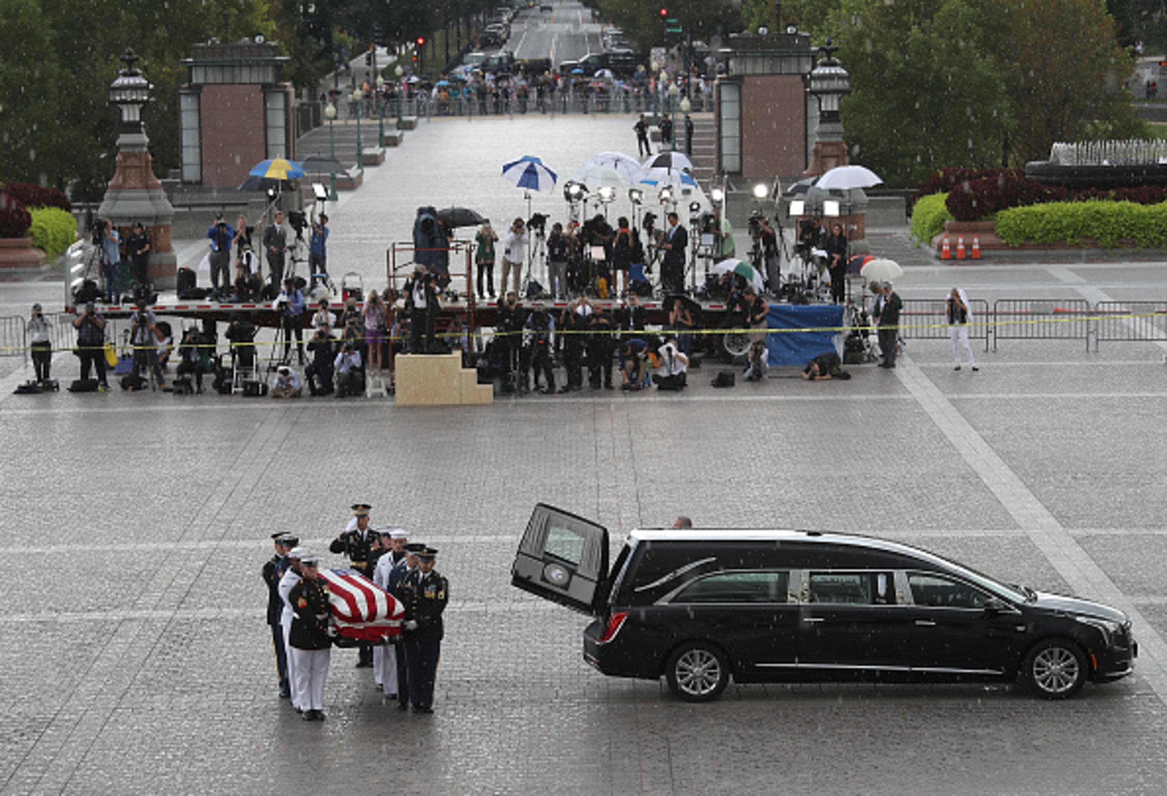 WASHINGTON, DC - AUGUST 31: A military honor guard team carries the casket of the late-Sen. John McCain (R-AZ) into the U.S. Capitol August 31, 2018 in Washington, DC. The late senator died August 25 at the age of 81 after a long battle with brain cancer. He will lie in state at the U.S. Capitol today, a rare honor bestowed on only 31 people in the past 166 years. Sen. McCain will be buried at his final resting place at the U.S. Naval Academy on Sunday. (Photo by Win McNamee/Getty Images)