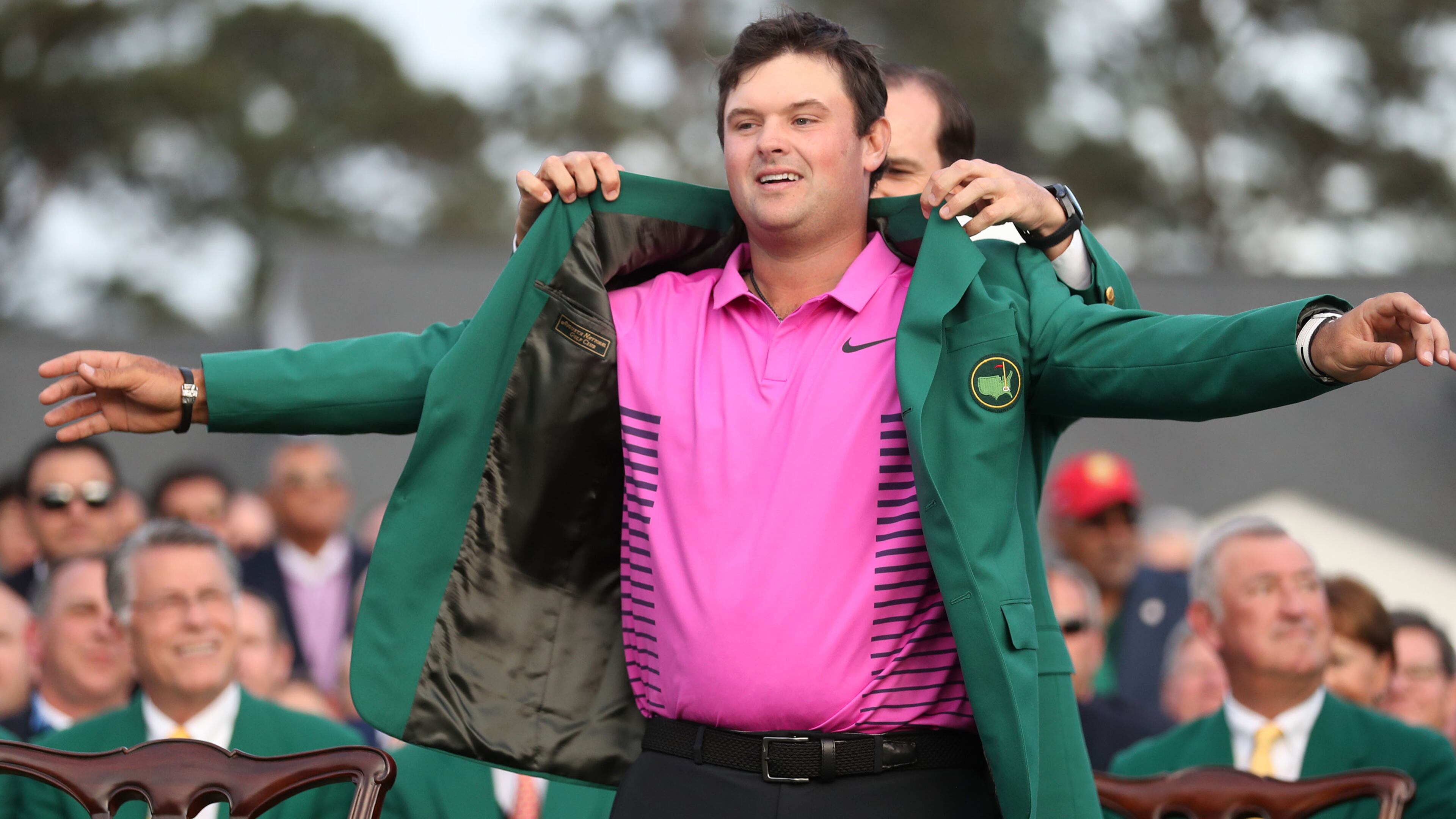 Patrick Reed tries on his new everyday jacket after winning the Masters. (Jason Getz/Atlanta Journal-Constitution/TNS)