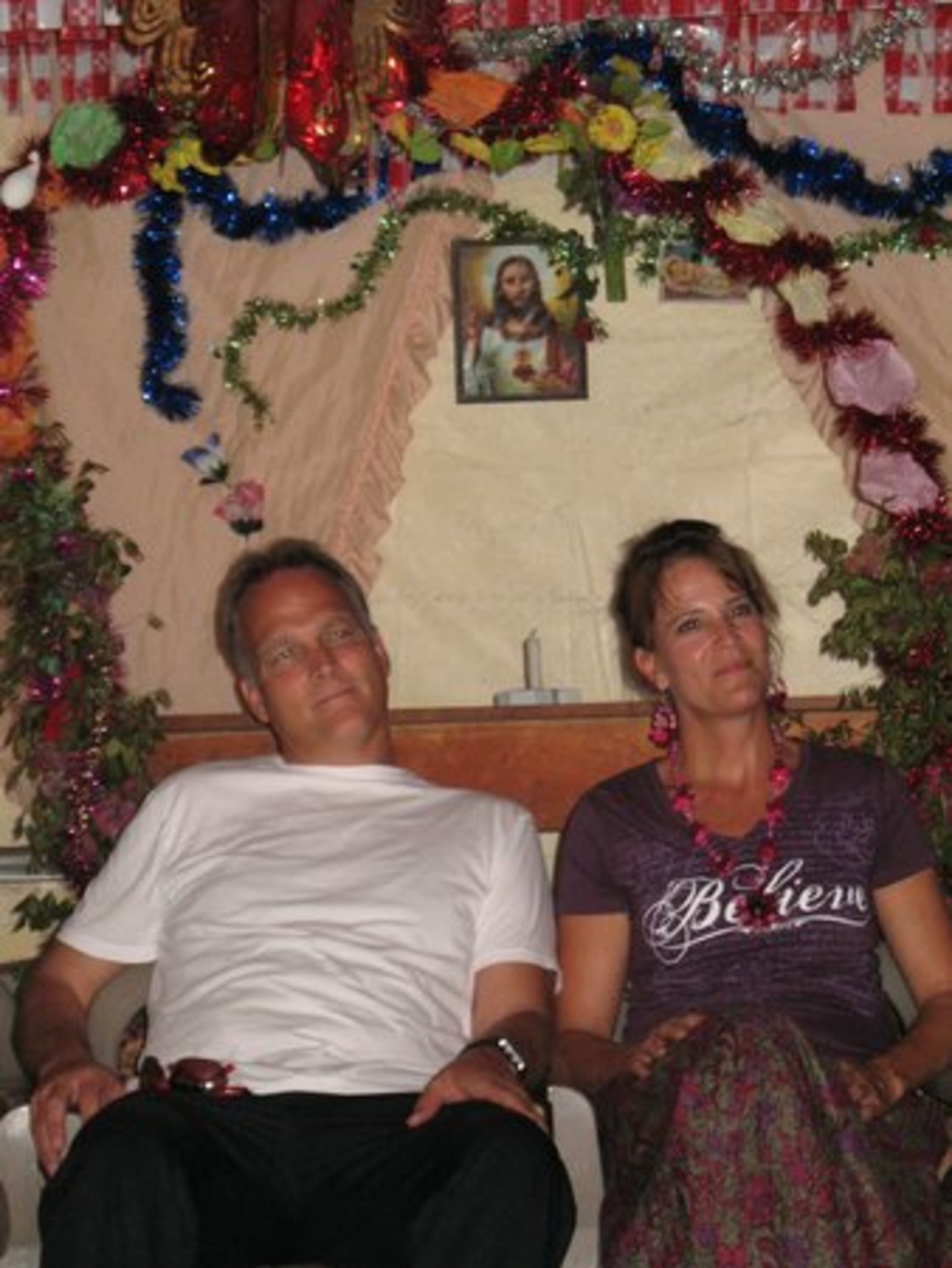 A village's tiny church is also a meeting place, where Mark and Katharyn Richt listen to residents of Portillo explain their need for a water system.