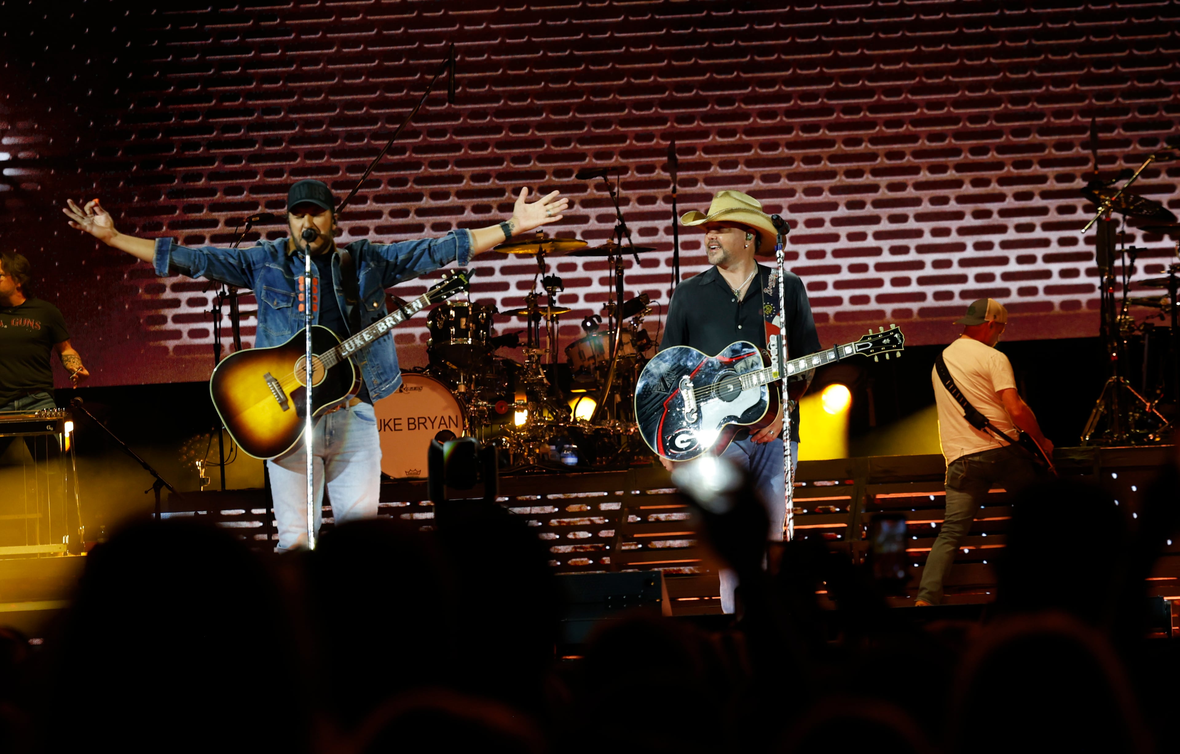 Georgia natives Jason Aldean (right) and Luke Bryan perform together for the first "Live Between the Hedges Concert Presented by PruittHealth" at Sanford Stadium, home of the University of Georgia football team, Saturday, April 25, 2026, in Athens. (Akili-Casundria Ramsess/EyeAkili Media)