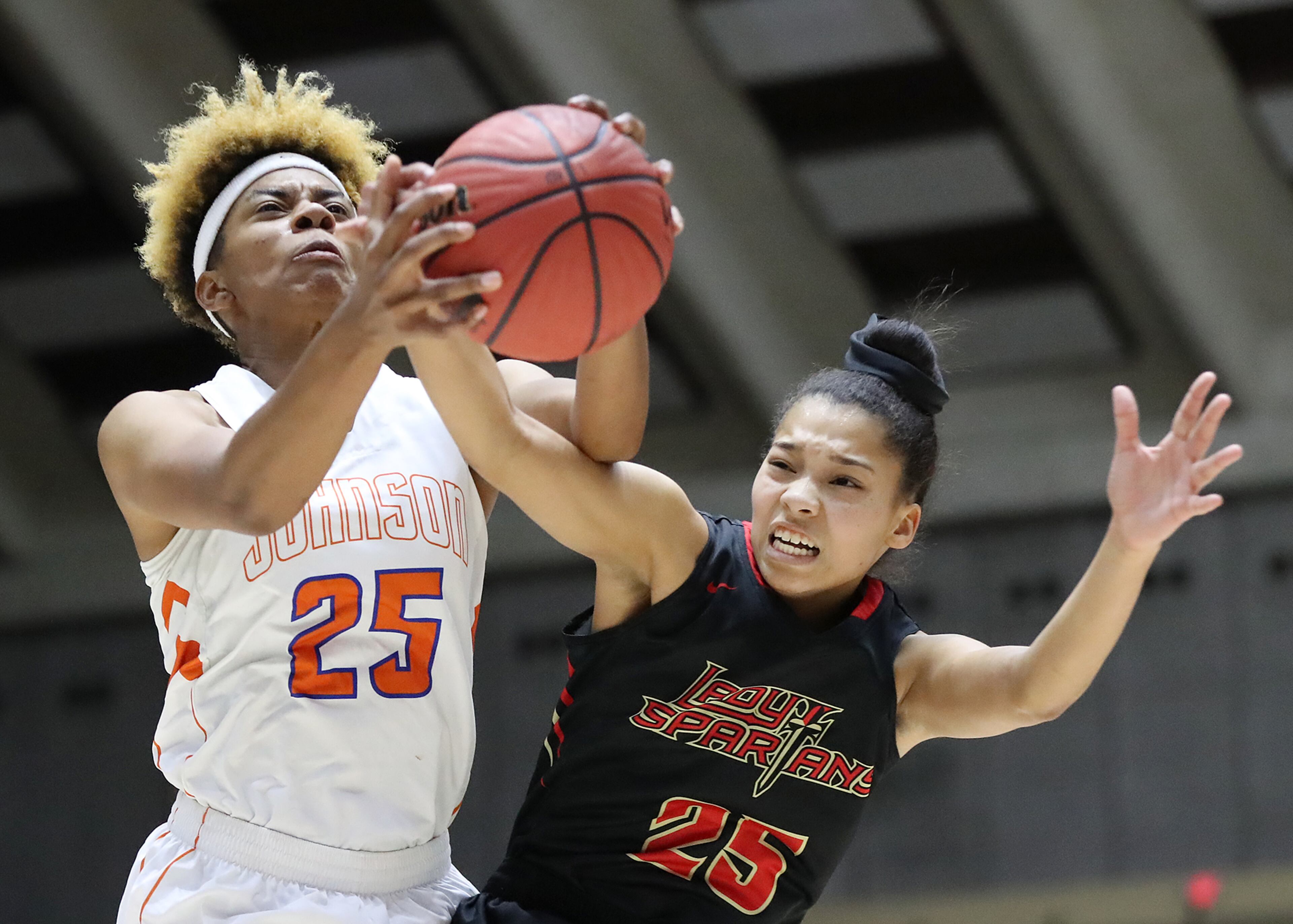 March 8, 2018 Macon: GAC forward Maya Timberlake and Johnson-Savannah center Giana Copeland battle for a rebound in their GHSA state basketball championship game on Thursday, March 8, 2018, in Macon. Curtis Compton/ccompton@ajc.com