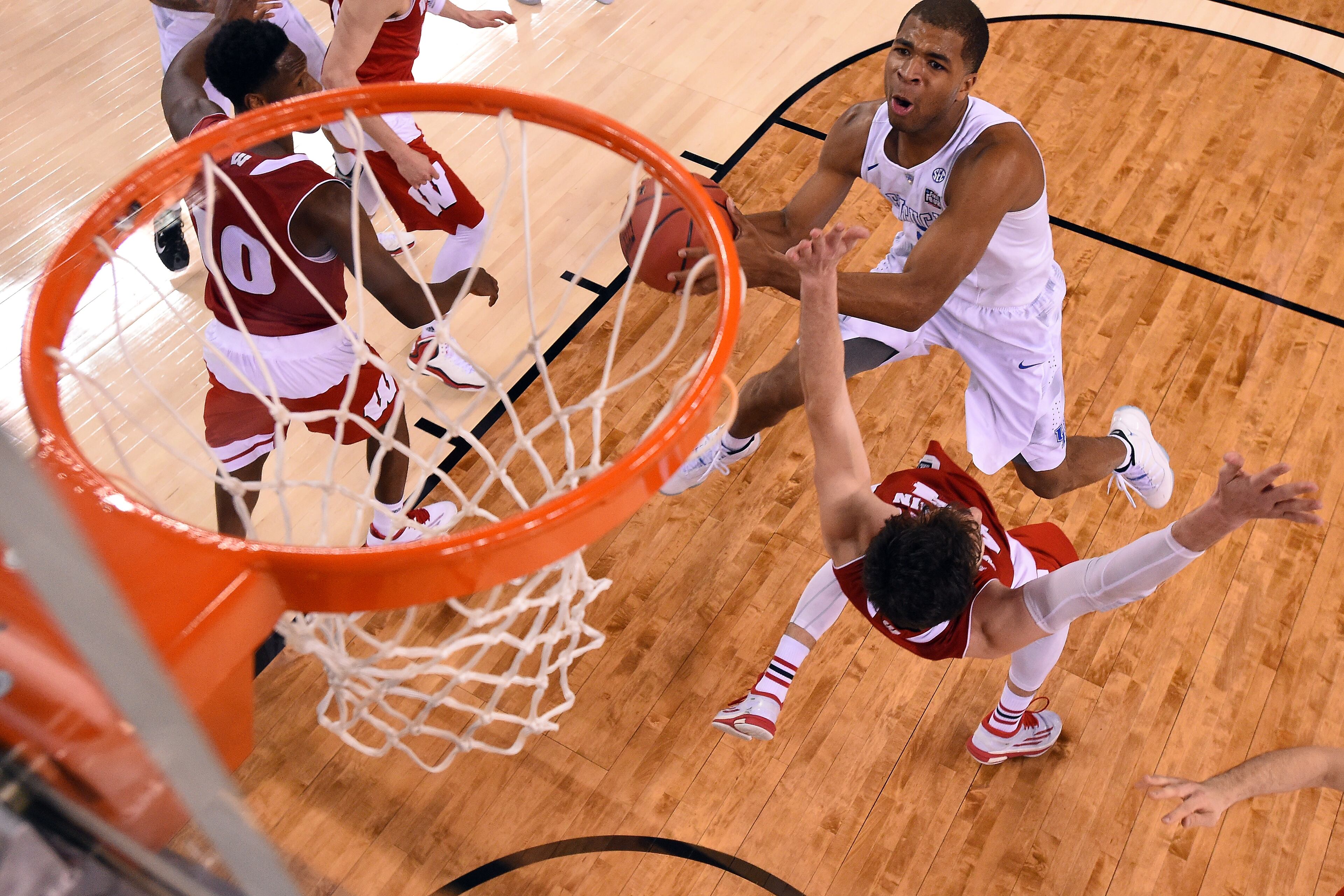 INDIANAPOLIS, IN - APRIL 04: Aaron Harrison #2 of the Kentucky Wildcats drives to the basket against Frank Kaminsky #44 of the Wisconsin Badgers in the second half during the NCAA Men's Final Four Semifinal at Lucas Oil Stadium on April 4, 2015 in Indianapolis, Indiana. (Photo by Chris Steppig - Pool/Getty Images)