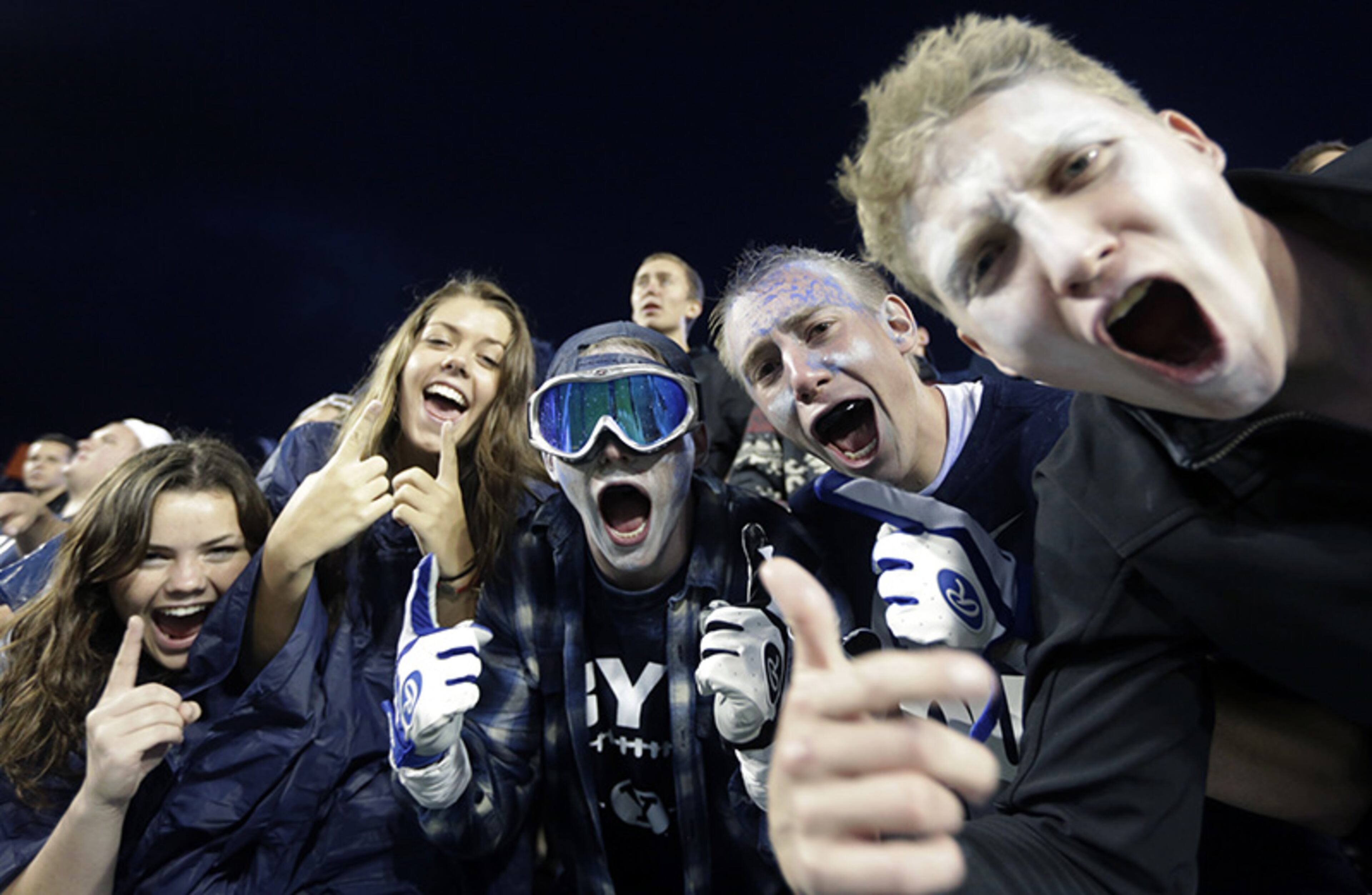 Brigham Young fans celebrate in the second quarter during an NCAA college football game against Texas, Saturday, Sept. 7, 2013, in Provo, Utah.