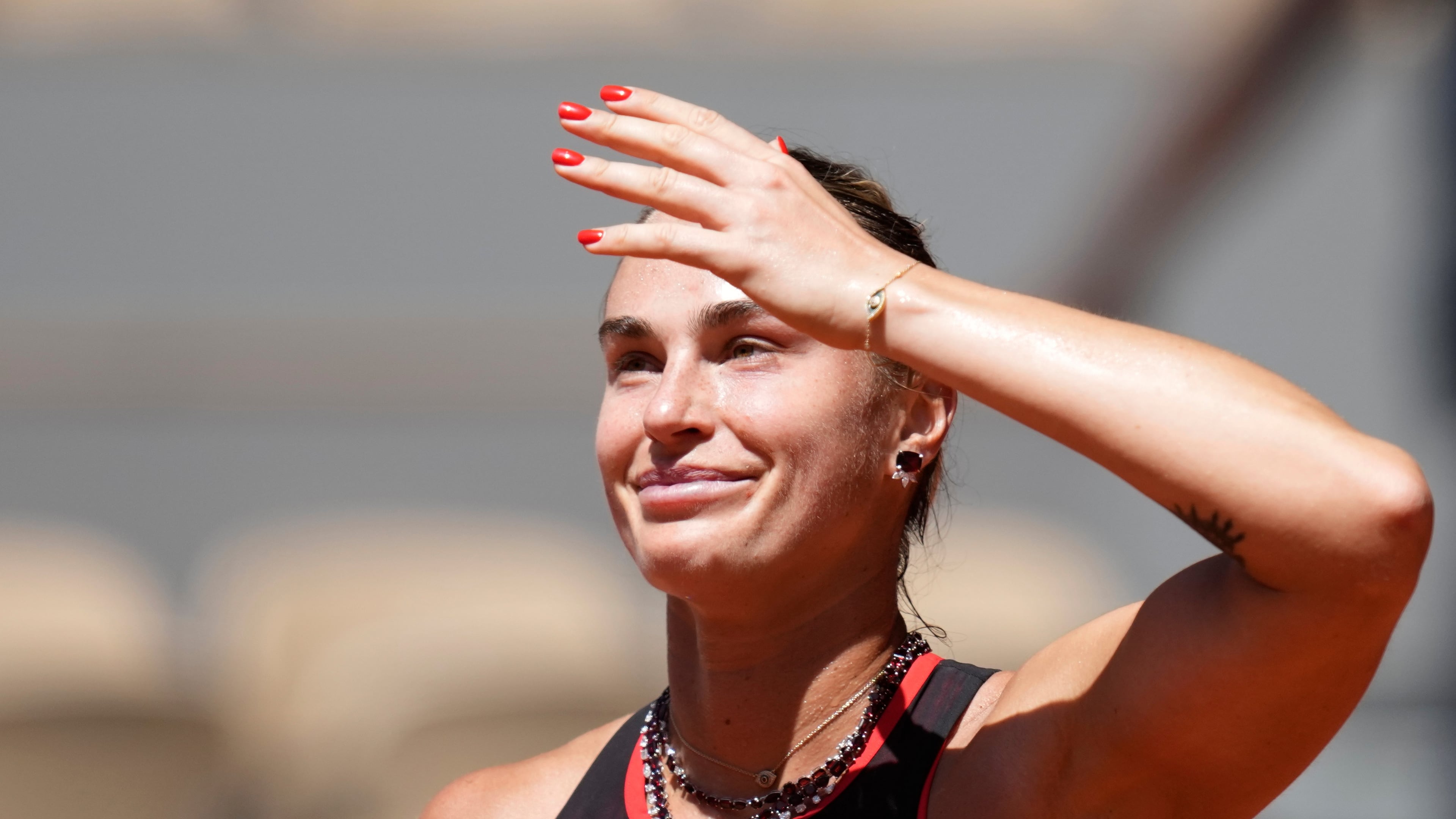 Aryna Sabalenka of Belarus celebrates after winning against Jessica Bouzas Maneiro of Spain during their first round women's singles tennis match at the French Open tennis tournament in Paris, Tuesday, May 26, 2026. (AP Photo/Christophe Ena)