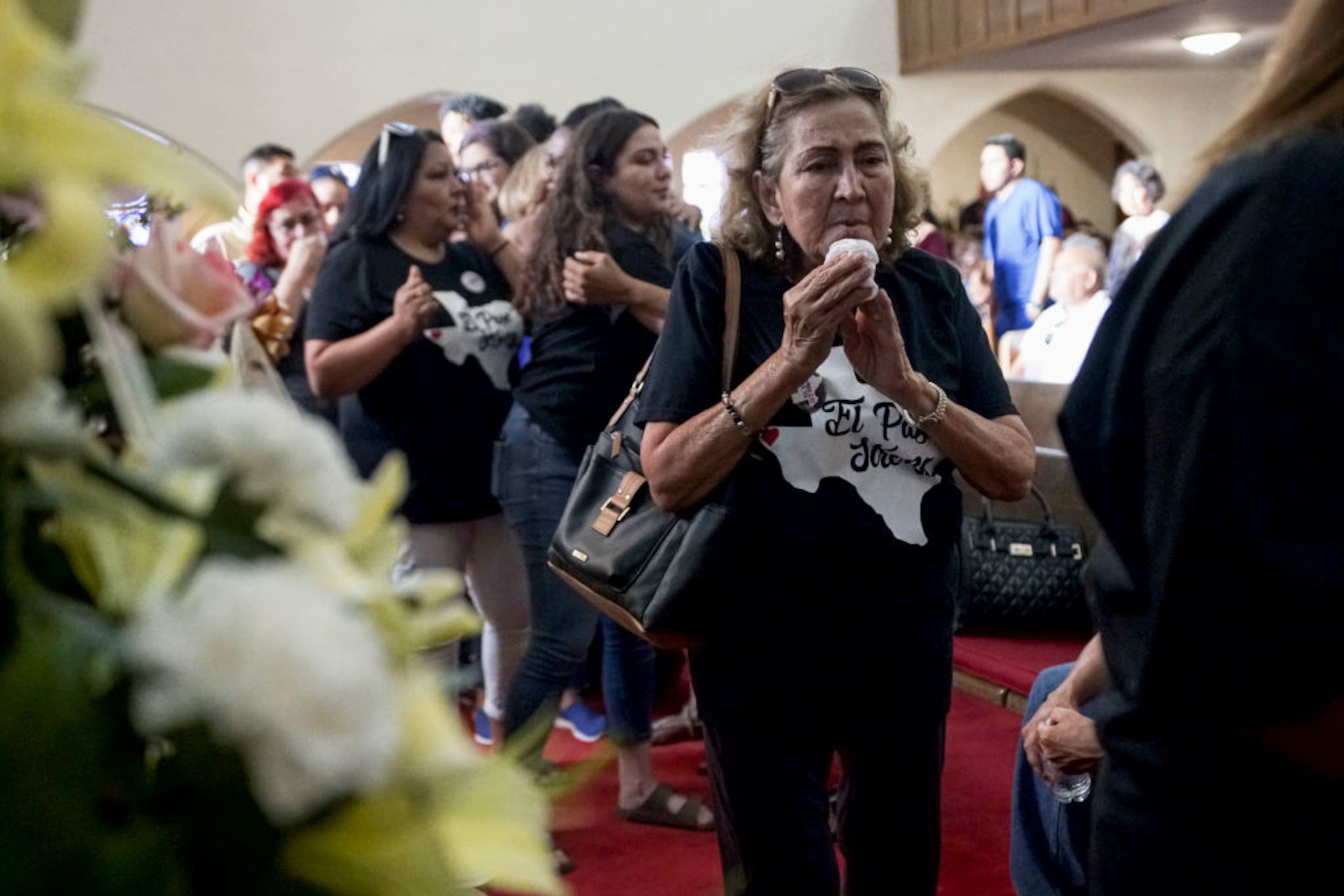 EL PASO, TX - AUGUST 16: Well wishers pay tribute at a public memorial for Margie Reckard, on August 16, 2019 in El Paso, Texas. Reckard was one of 22 killed during the Walmart shooting in El Paso on August 3rd. Her husband, Antonio Basco, invited the public to attend the memorial in her honor and has laid fresh flowers everyday since the shooting at a make-shift memorial outside the outlet.(Photo by Sandy Huffaker/Getty Images)