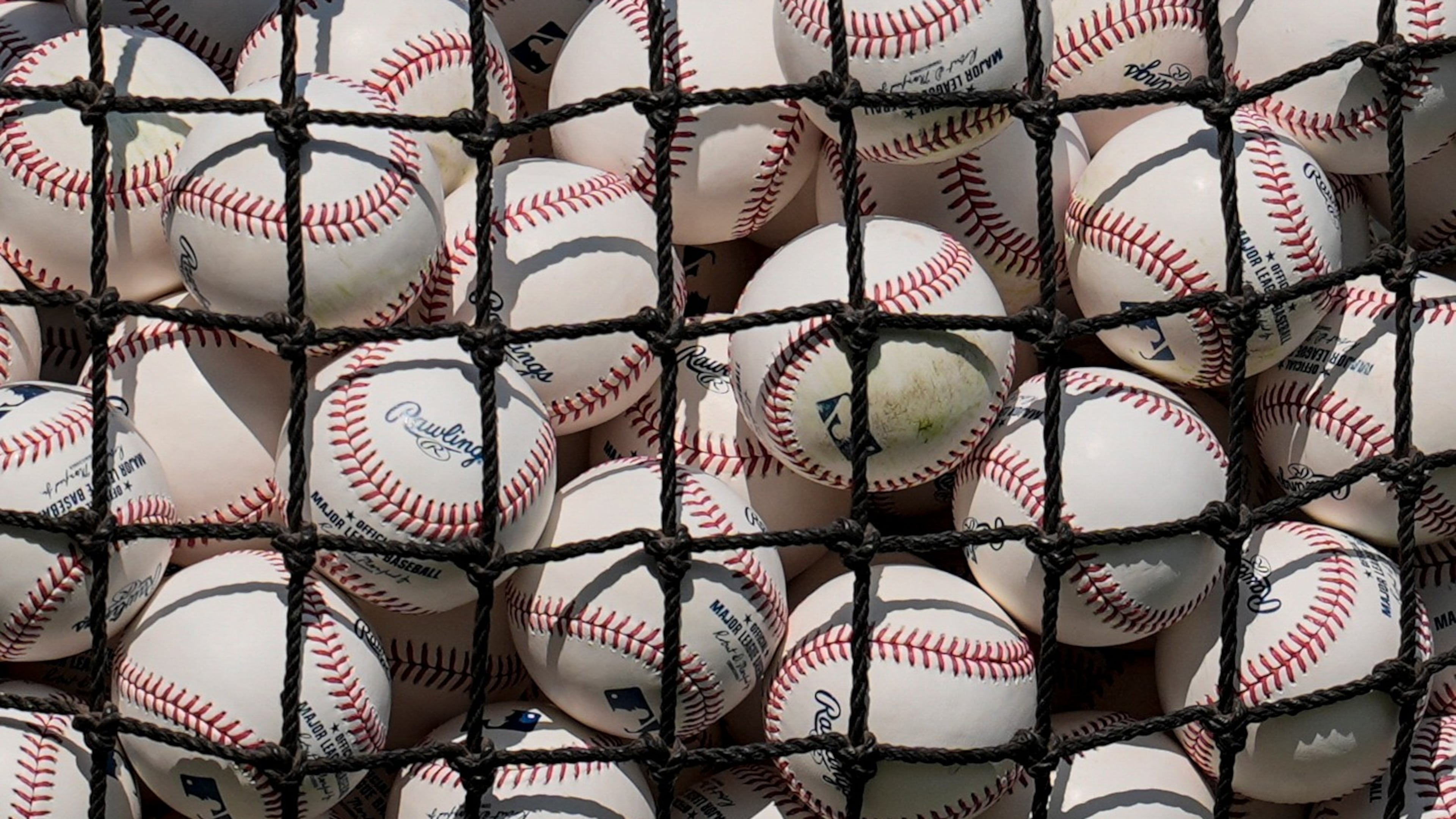 MLB baseballs are seen before a baseball game between the Atlanta Braves and the St. Louis Cardinals, Tuesday, June 30, 2026, in Atlanta. (AP Photo/Mike Stewart)
