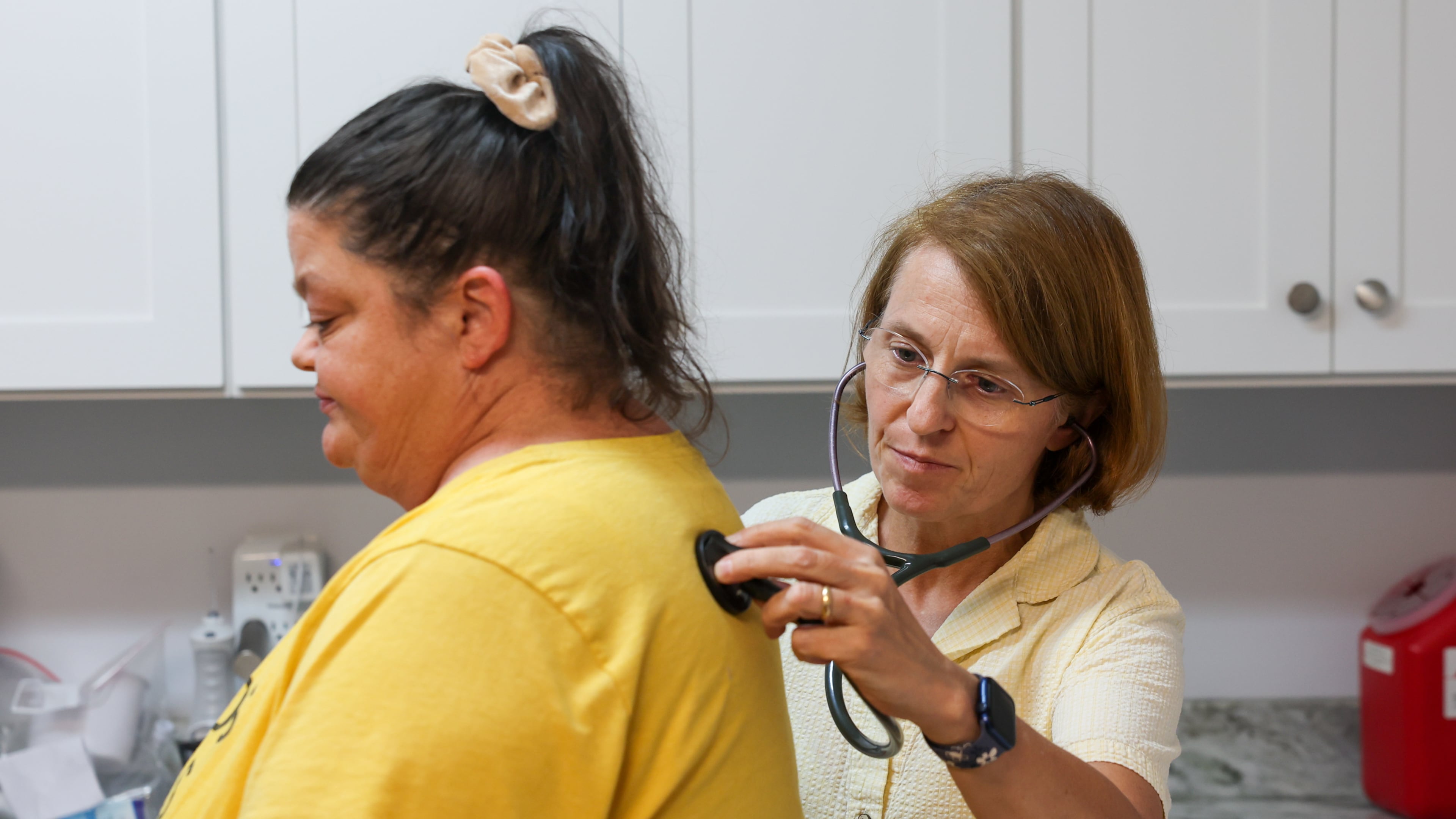 Patient Angela Tyler is seen by volunteer doctor Lenka Novotna at Open Arms Clinic, a free clinic in Toccoa, on Sept. 29, 2026. The clinic provides free care to low-income residents who make less than $20,000 a year. Since COVID-era enhanced Obamacare subsidies expired late last year, the clinic's patient load has doubled. (Arvin Temkar/AJC)