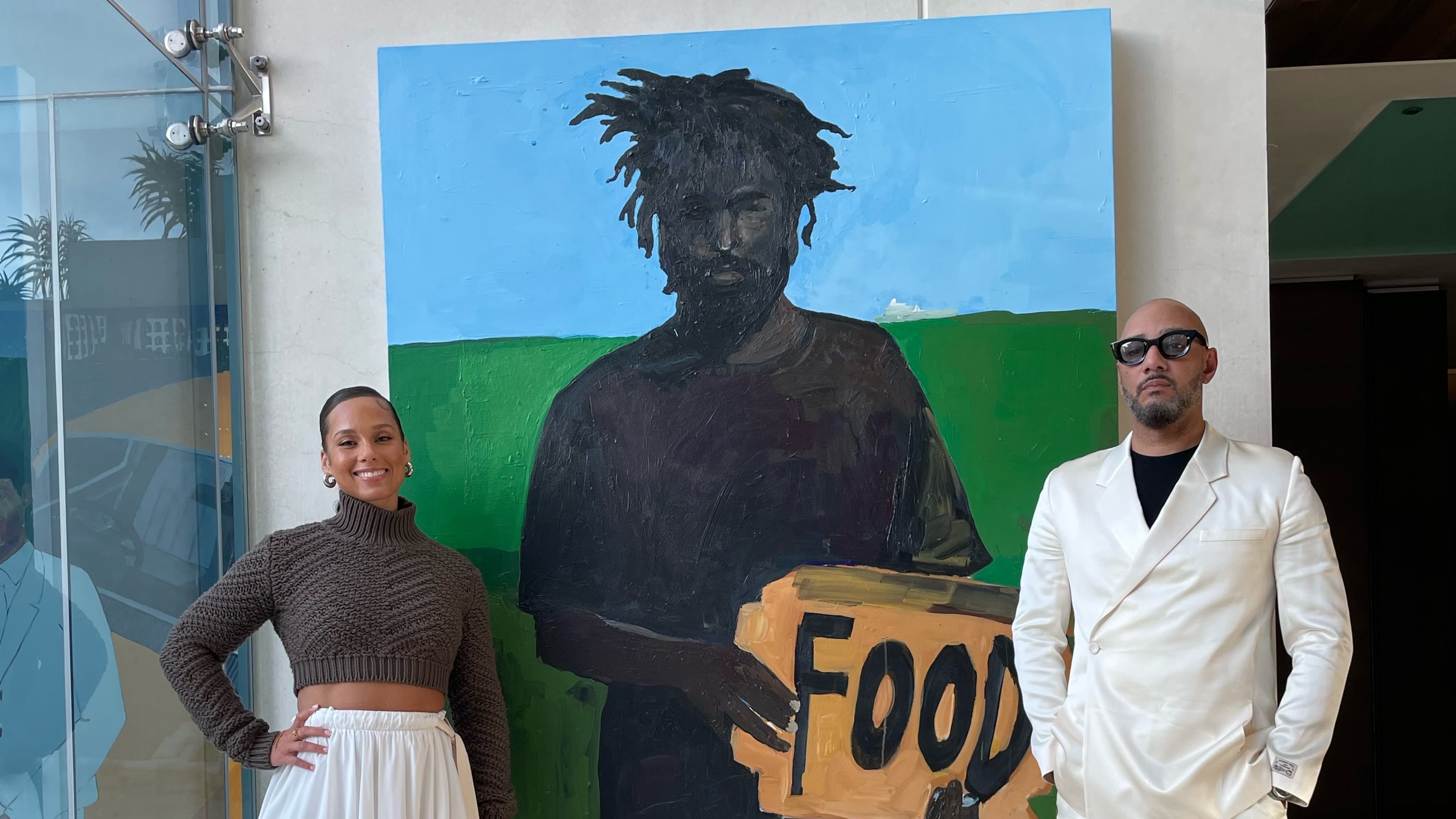 Alicia Keys and Swizz Beats with Henry Taylor's "Cornerstone." Photo by Cole Cook