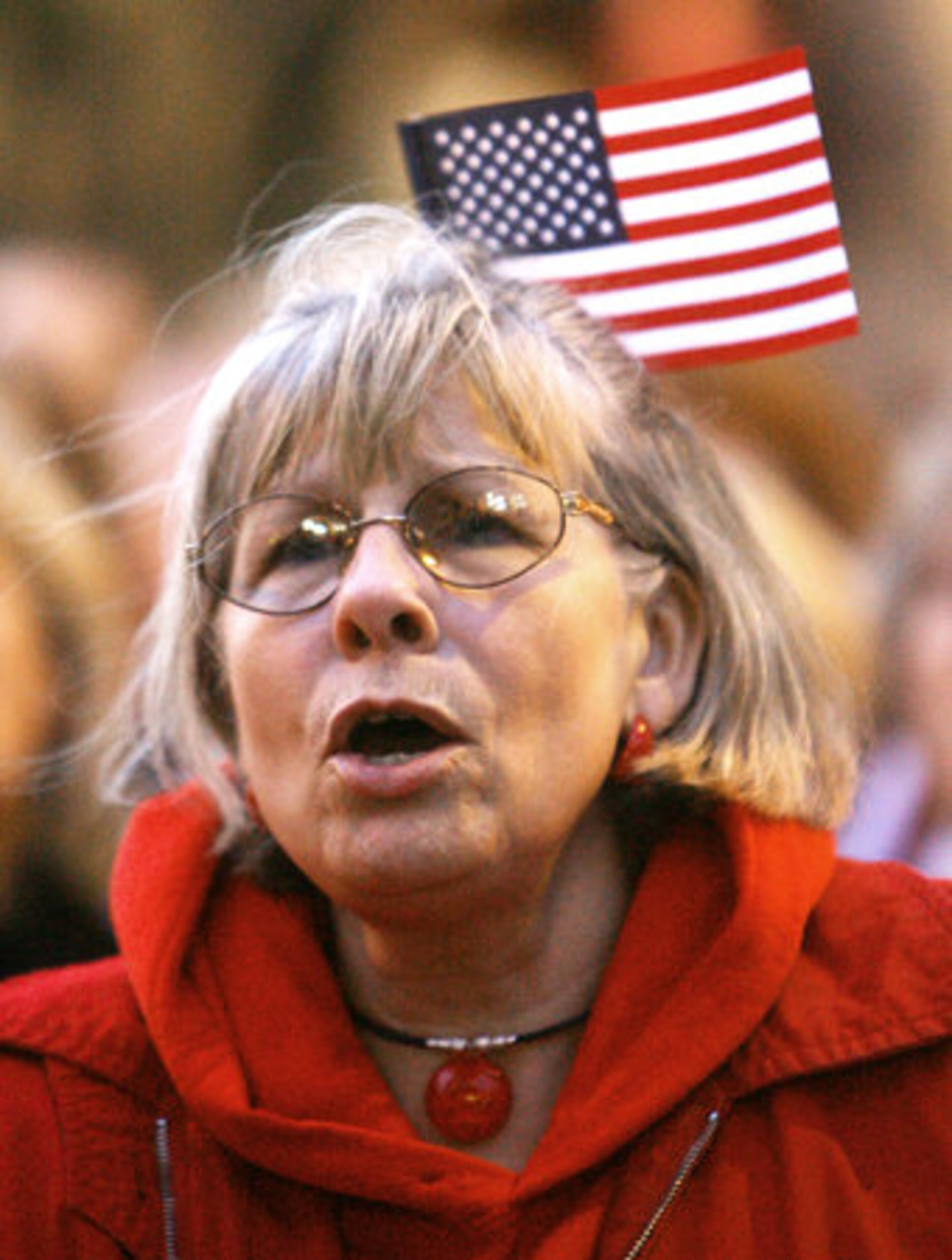 Sue White of Canton shouts with other protesters at the Capitol.