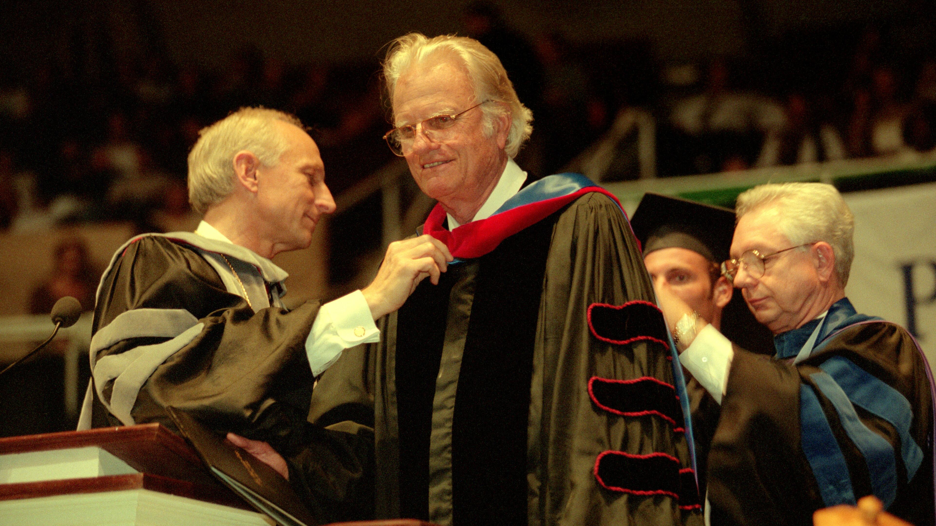 The Rev. Billy Graham was presented an honorary doctorate degree on Saturday, April 26, 1997, by Palm Beach Atlantic College President Paul Corts during graduation ceremonies in West Palm Beach. (Scott Wiseman/1997 Palm Beach Post file photo)