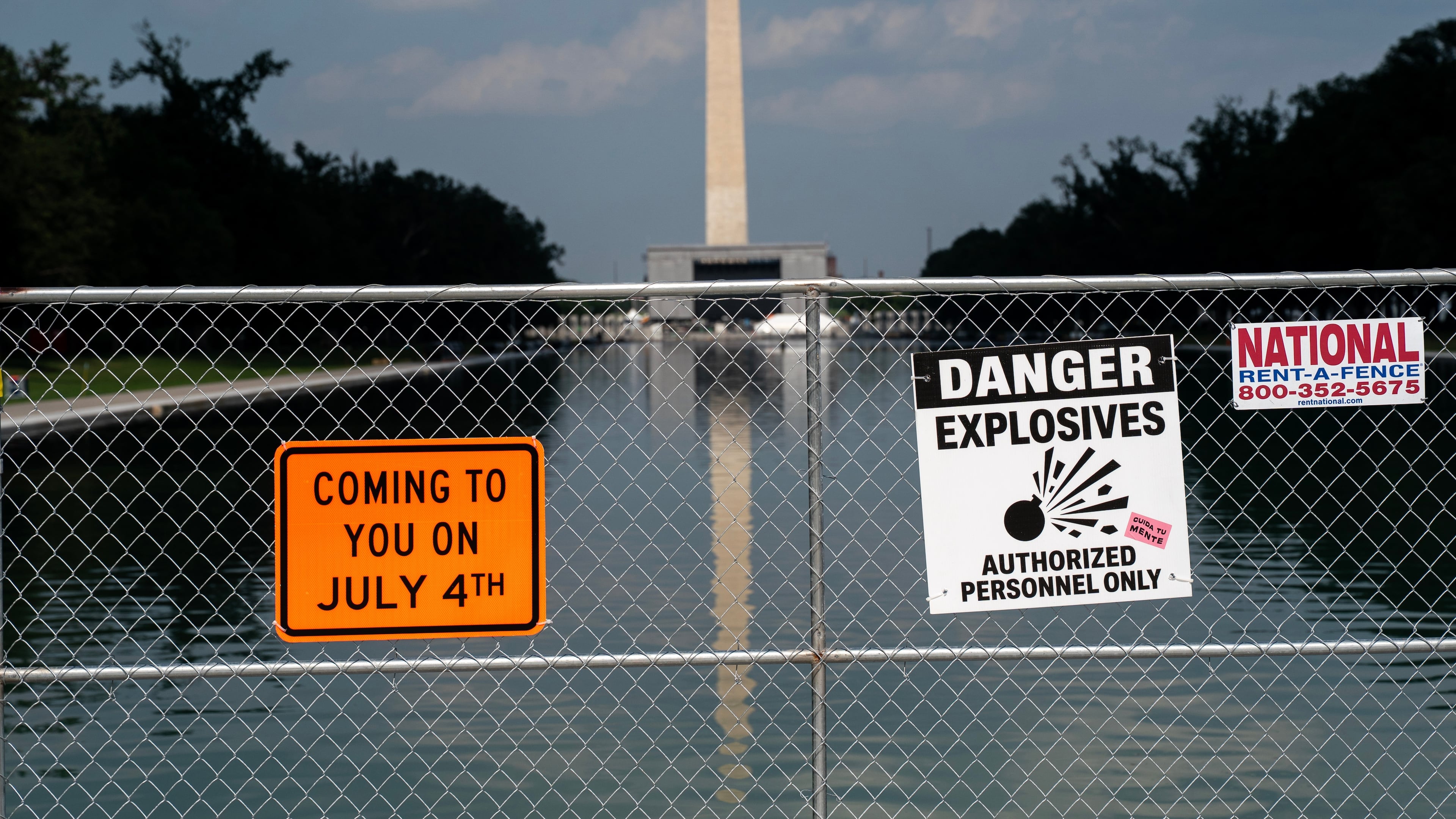 Signage and security fencing warns of explosives along the Lincoln Memorial Reflecting Pool ahead of July 4th events on the National Mall, Wednesday, July 1, 2026, in Washington. (AP Photo/Nathan Howard)