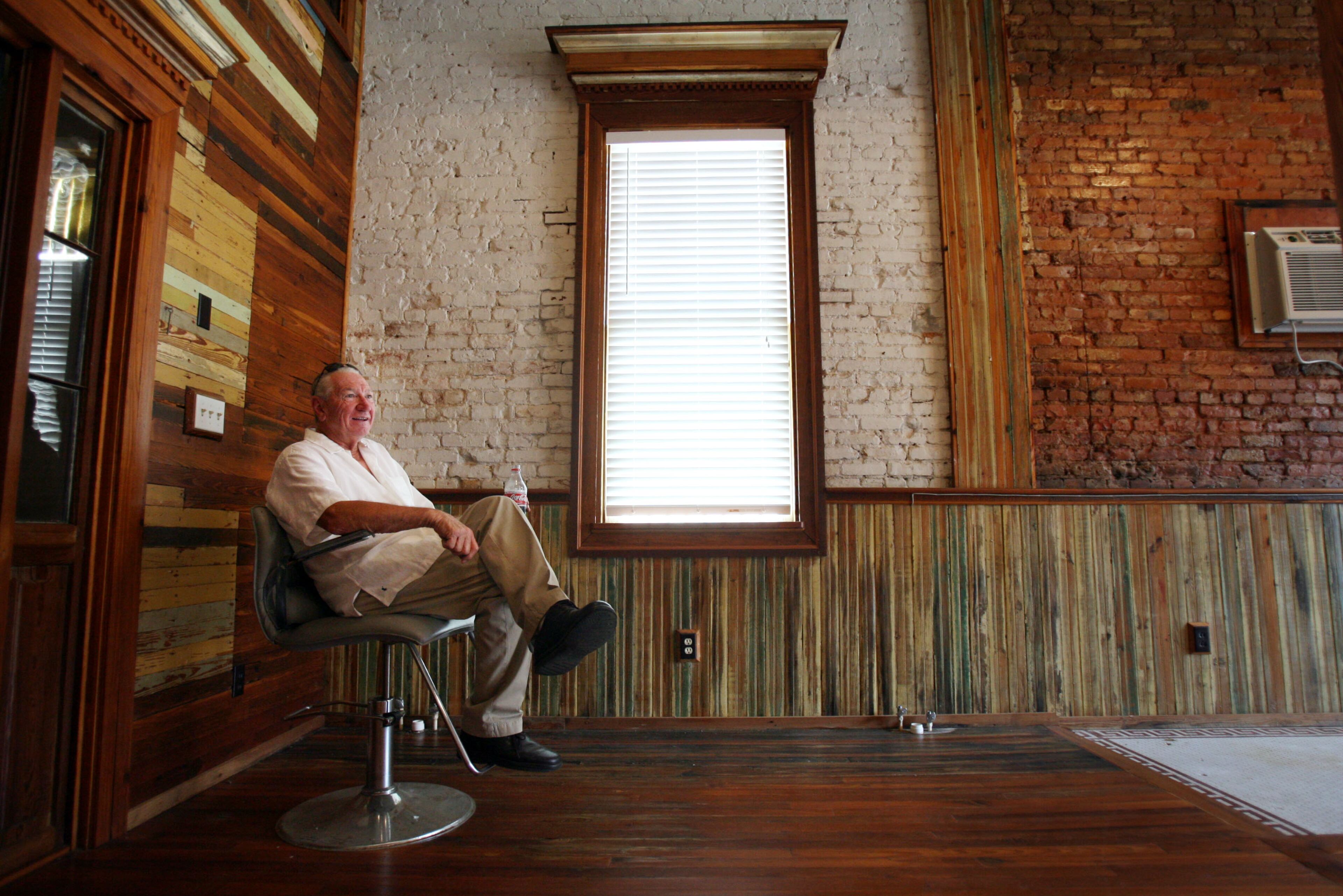 060711 - EDISON, GA -- Atlanta Braves bullpen coach Bobby Dews (cq) sits in a styling chair in a former bank buiilding in downtown Edison Tuesday, July 11, 2006. Dews bought the building, and a friend's daughter will be opening a beauty salon in the back of the building. Dews has mentioned the possiblity of opening a coffee shop in the front half of the building. (BITA HONARVAR/AJC staff)