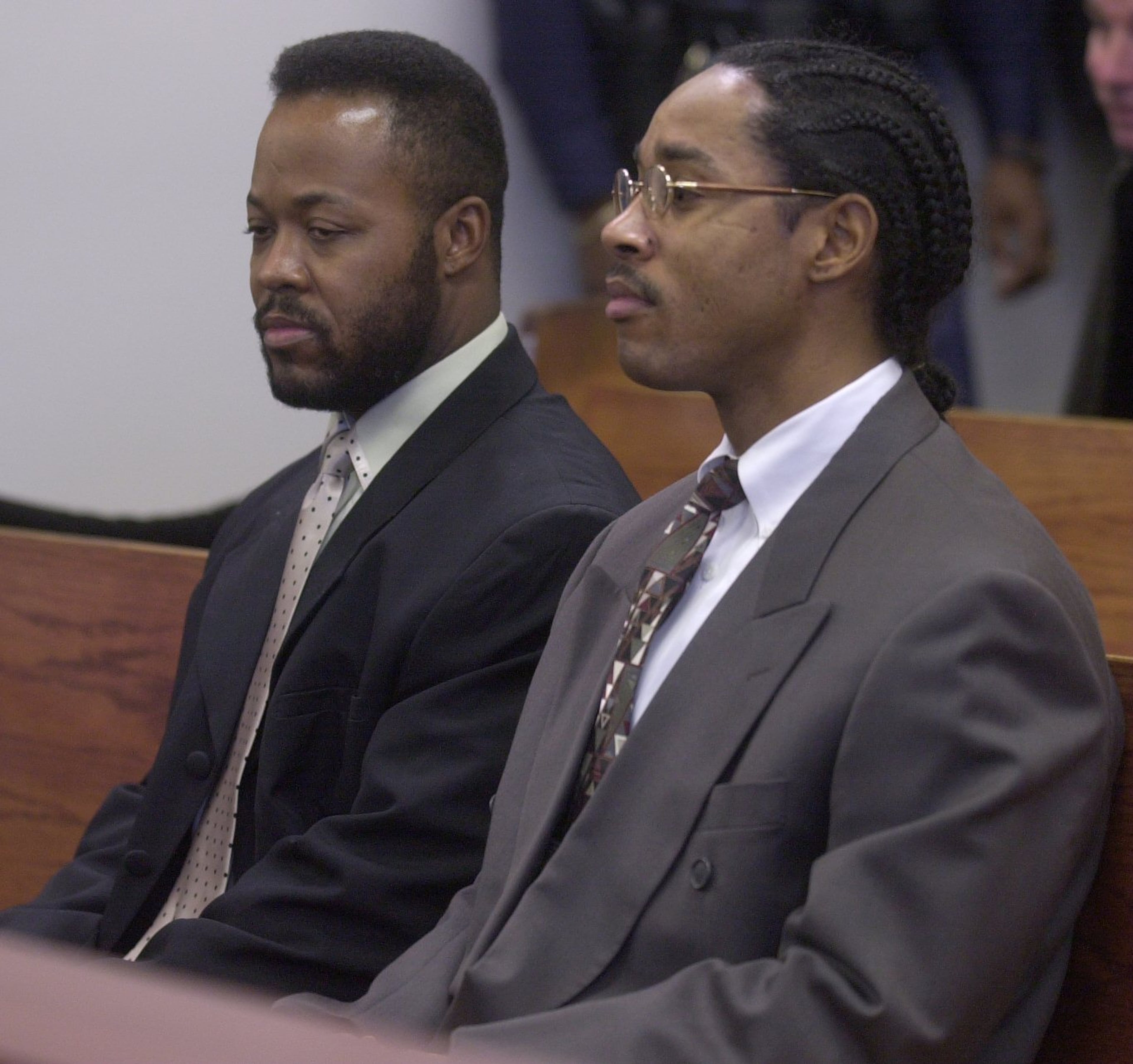Jan. 2002 -- Melvin Walker (left) and David Ramsey (right) wait in DeKalb Superior Court to be arraigned for charges in the Derwin Brown murder. (Renee Hannans / AJC File)