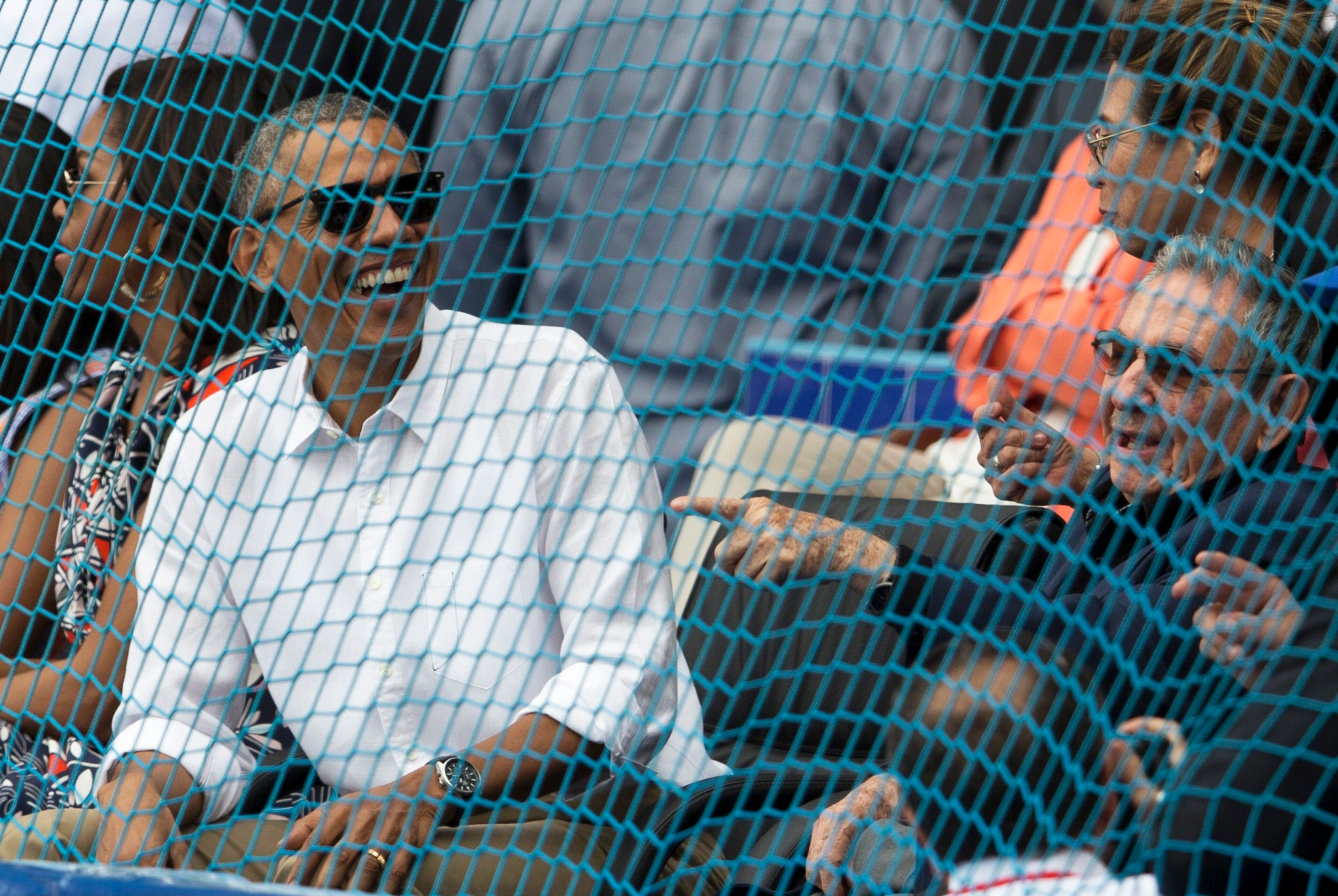 Cuban President Raul Castro, right, and U.S. President Barack Obama enjoy the game. (Ismael Francisco/Cubadebate via AP)