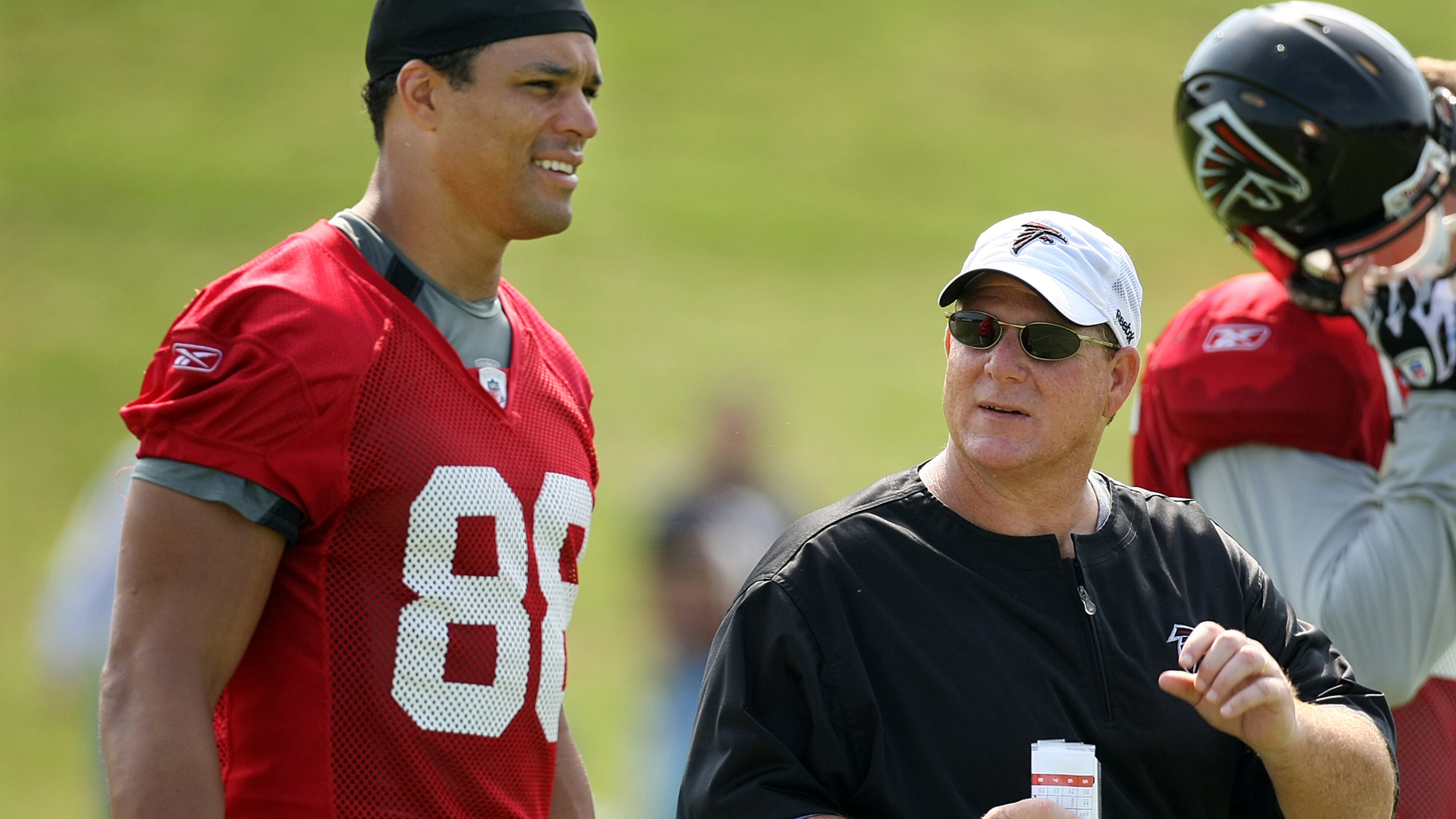 Falcons tight ends coach Chris Scelfo works on getting # 88 Tony Gonzalez up to speed on the team play book during training camp Thursday, Aug. 6, 2009, at Flowery Branch.