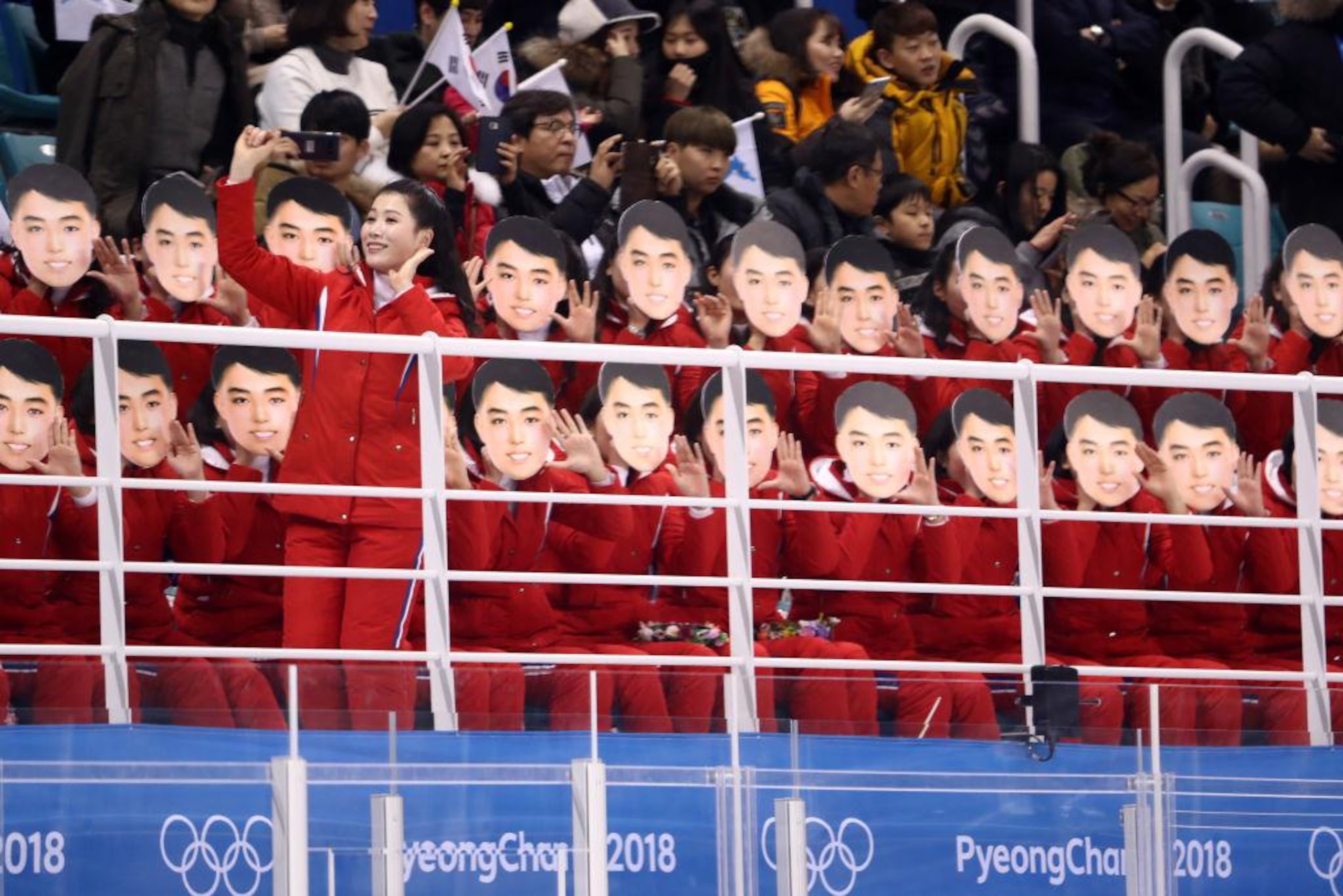 GANGNEUNG, SOUTH KOREA - FEBRUARY 10: North Korean cheerleaders sing and wave during the Women's Ice Hockey Preliminary Round - Group B game between Switzerland and Korea on day one of the PyeongChang 2018 Winter Olympic Games at Kwandong Hockey Centre on February 10, 2018 in Gangneung, South Korea. (Photo by Ronald Martinez/Getty Images)