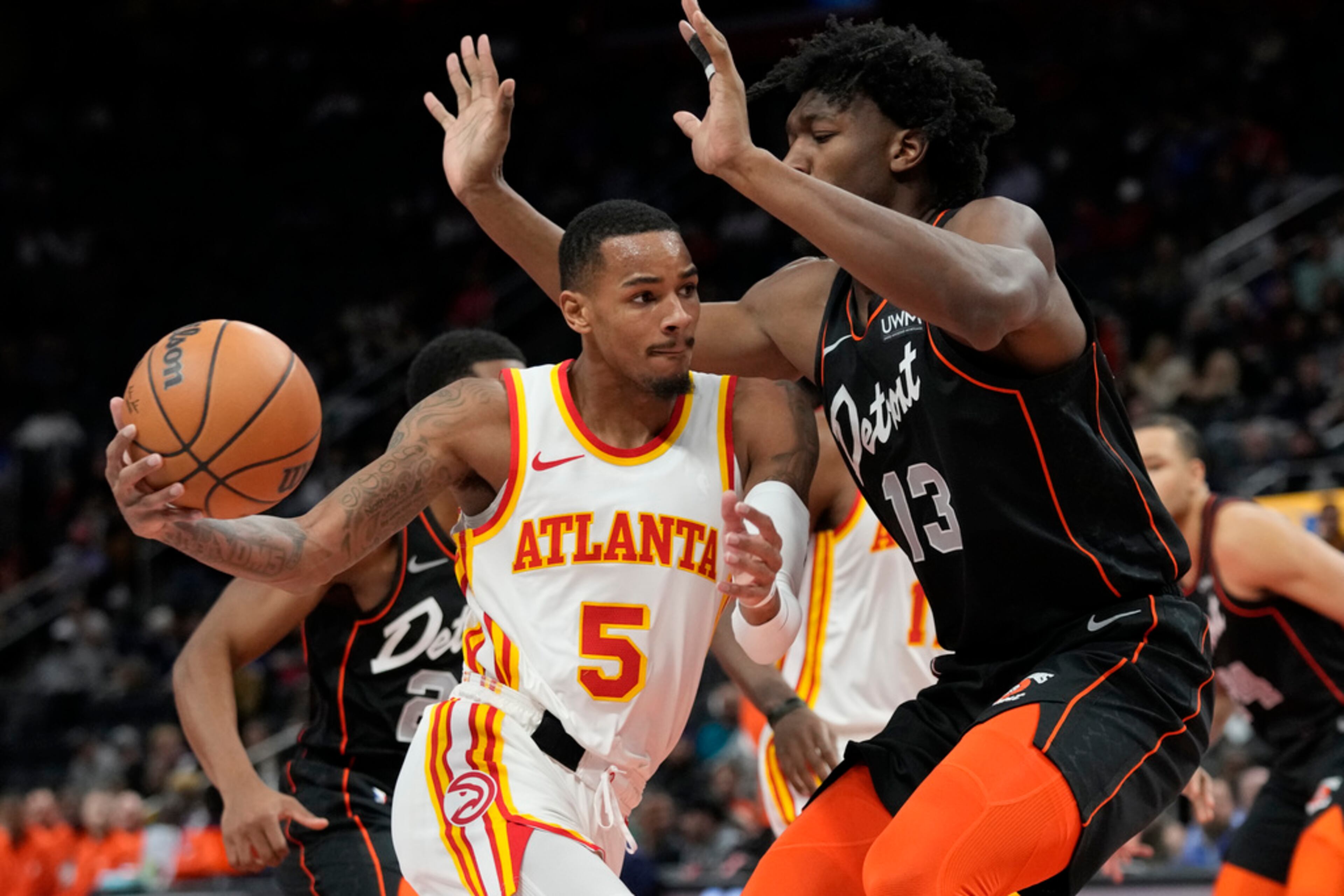 Atlanta Hawks guard Dejounte Murray (5) runs into the defense of Detroit Pistons center James Wiseman (13) during the first half of an NBA basketball game, Tuesday, Nov. 14, 2023, in Detroit. (AP Photo/Carlos Osorio)