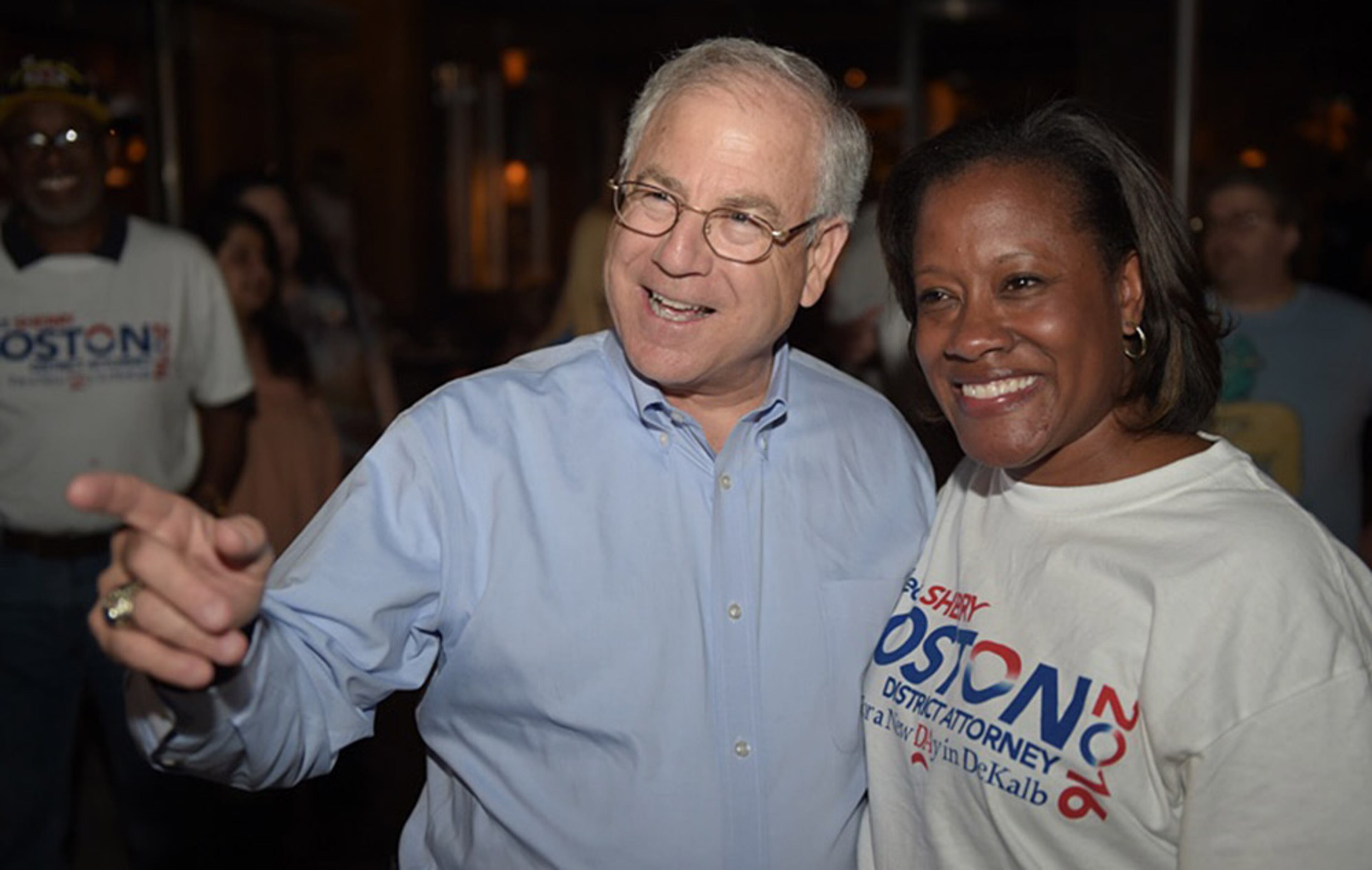 DeKalb DA candidate Sherry Boston celebrates with former prosecutor Bob Wilson at a watch party where she celebrated her win over incumbent Robert James during Tuesday's primary.