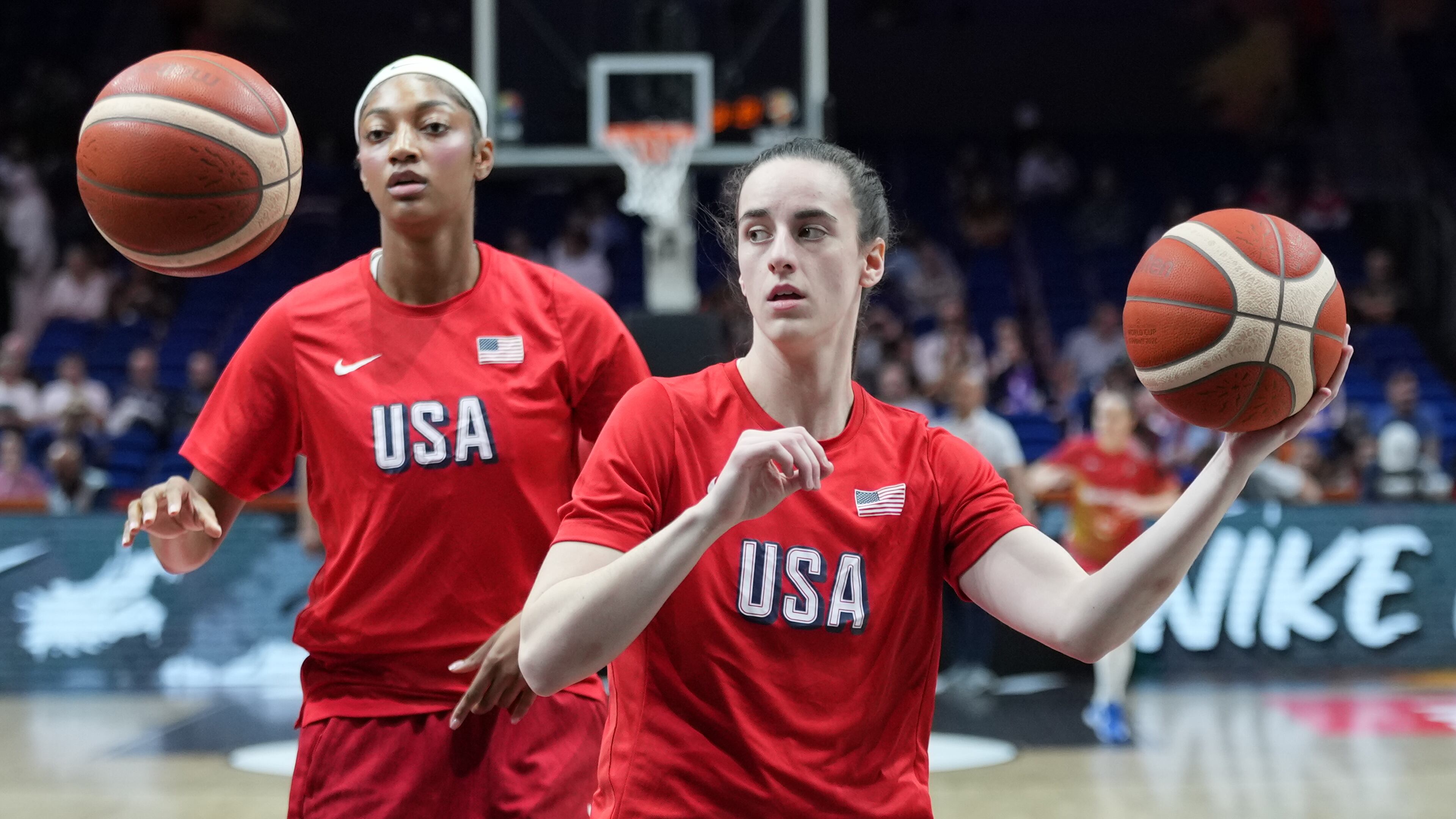Angel Reese, of the United States, left, and United States' Caitlin Clark warm up for the Women's Basketball World Cup quarterfinal match between the United States and Hungary in Berlin, Thursday, Sept. 10, 2026. (AP Photo/Ebrahim Noroozi)