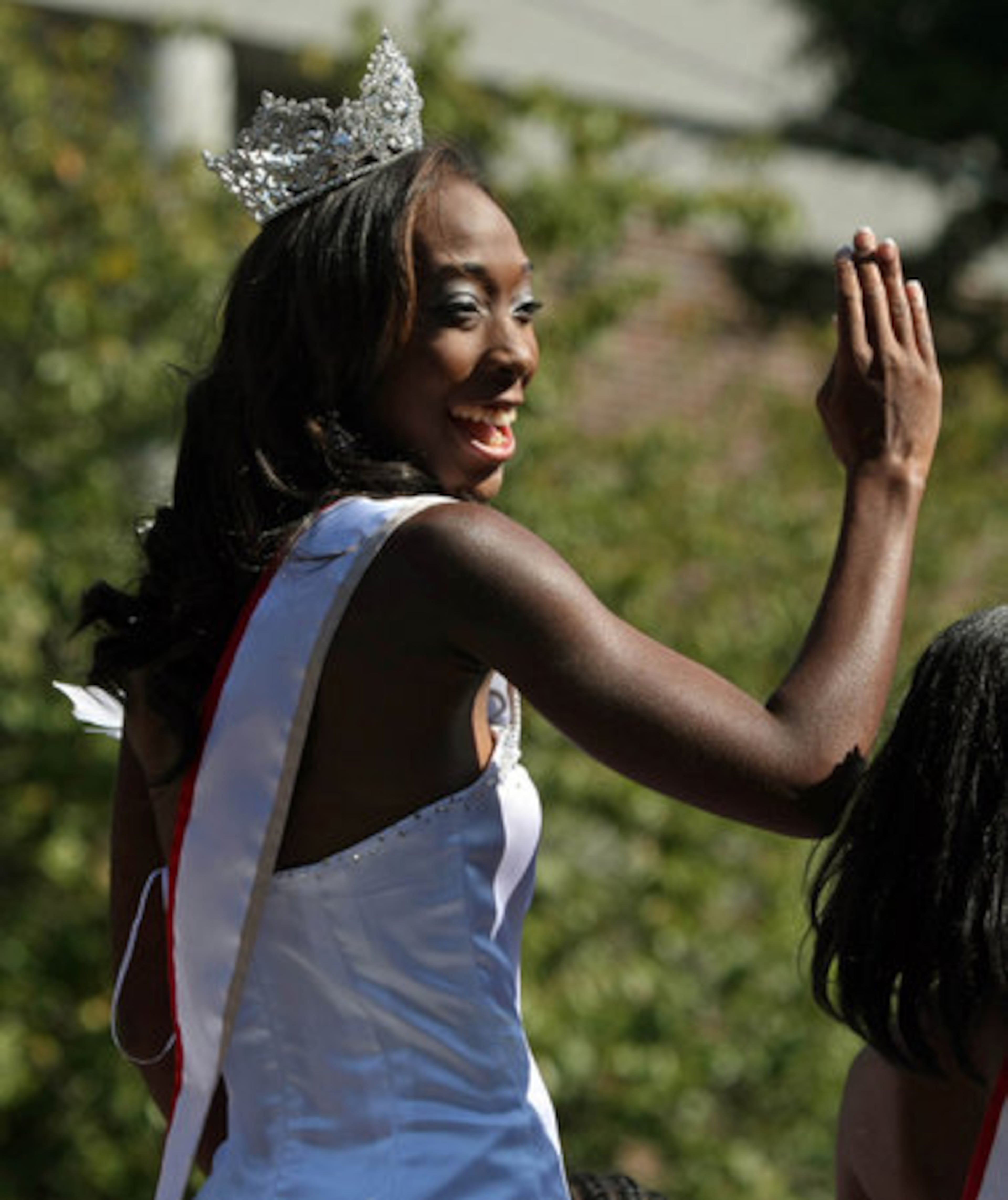 Miss Clark Atlanta University DeJonique Garrison, of New Orleans, waves to the crowd as she goes by on a float during the CAU homecoming parade on Fair Street Saturday morning in Atlanta. Garrison, a senior, was crowned Miss CAU Thursday night.