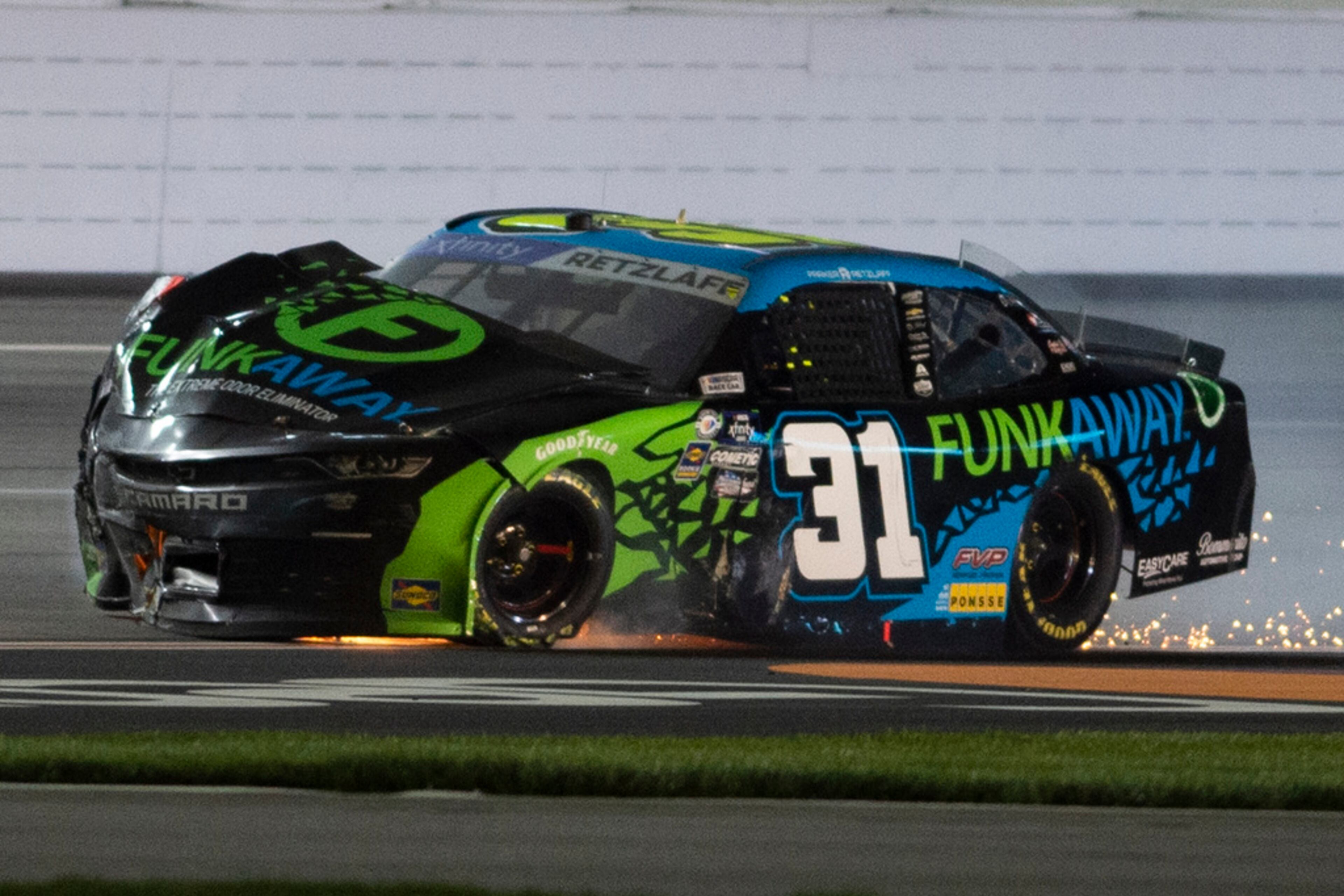 Parker Retzlaff crashes during the NASCAR Xfinity Series auto race at Atlanta Motor Speedway on Saturday, March 18, 2023, in Hampton, Ga. (AP Photo/Hakim Wright Sr.)