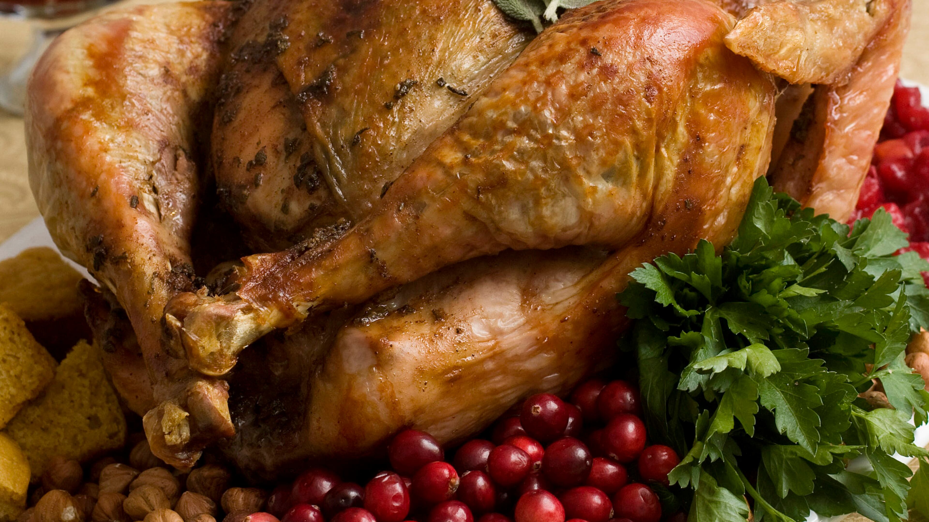 FILE - This Nov. 2, 2009, file photo shows a Thanksgiving turkey in Concord, N.H. Food safety experts say raw turkeys shouldnt be rinsed, since that can spread harmful bacteria. Cooking should kill any germs. But bacteria can still spread in other ways, so washing and sanitizing hands and surfaces is still important. (AP Photo/Larry Crowe, File)