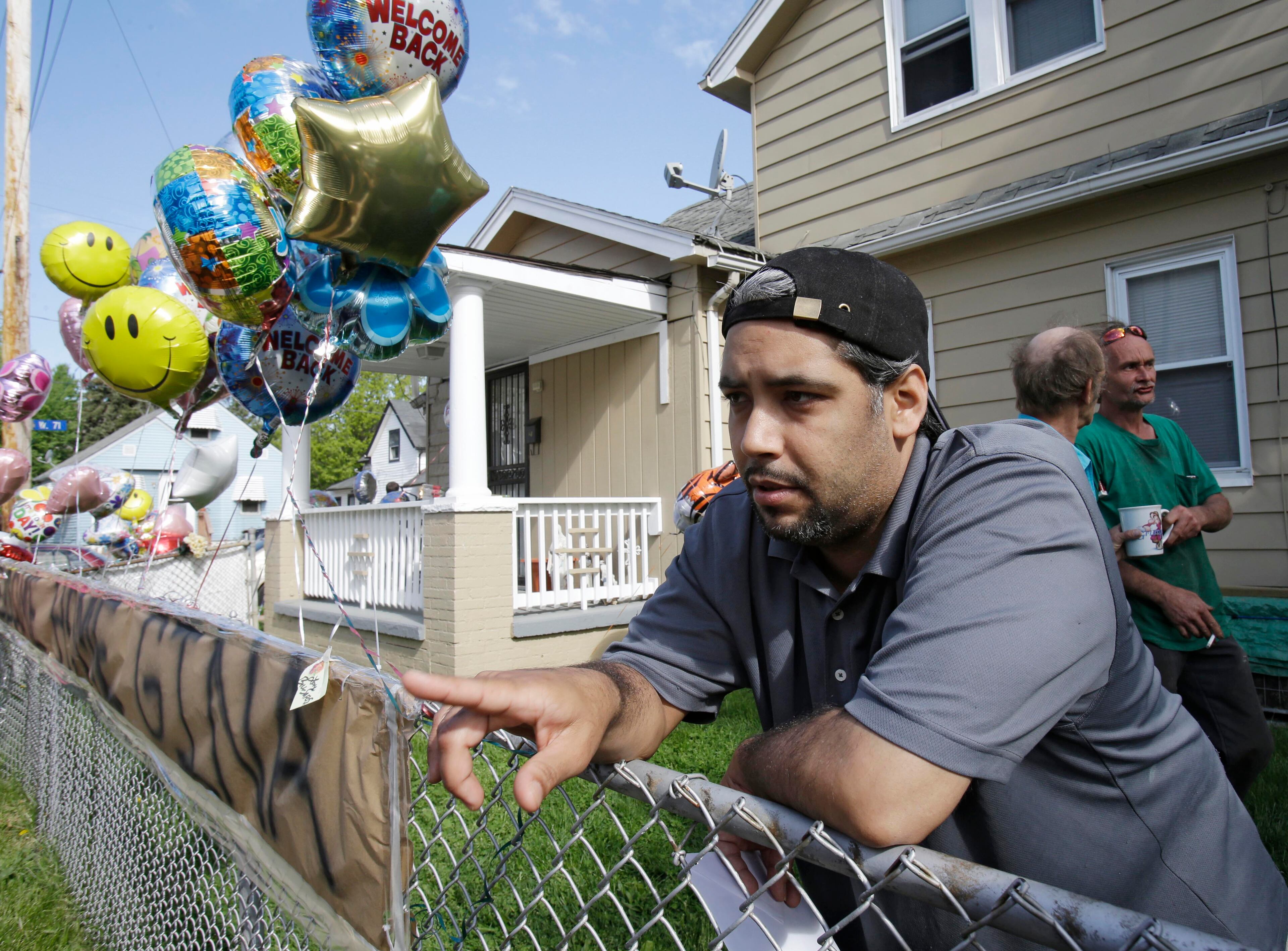 Ricardo DeJesus talks about his sister, Gina, at the family May 7, 2013, in Cleveland.