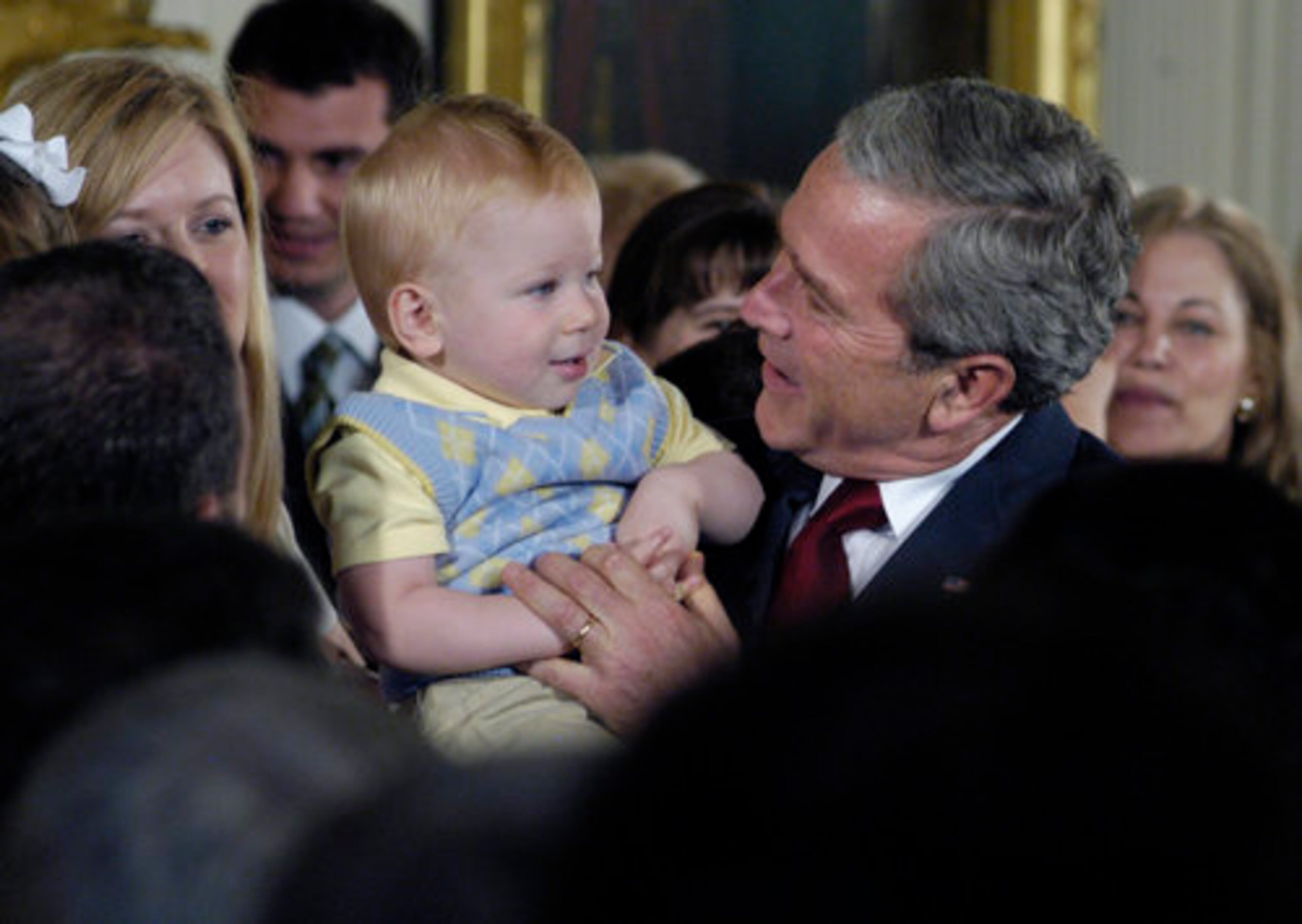 July 19, 2006 -- President George W. Bush issued the first veto of his administration to reject a bill that would have ended federal funding constraints on human embryonic stem cell research. Bush holds fourteen month old Jack Lewis "Trey" Jones, one of the "snowflake babies" born from adopted frozen embryos.