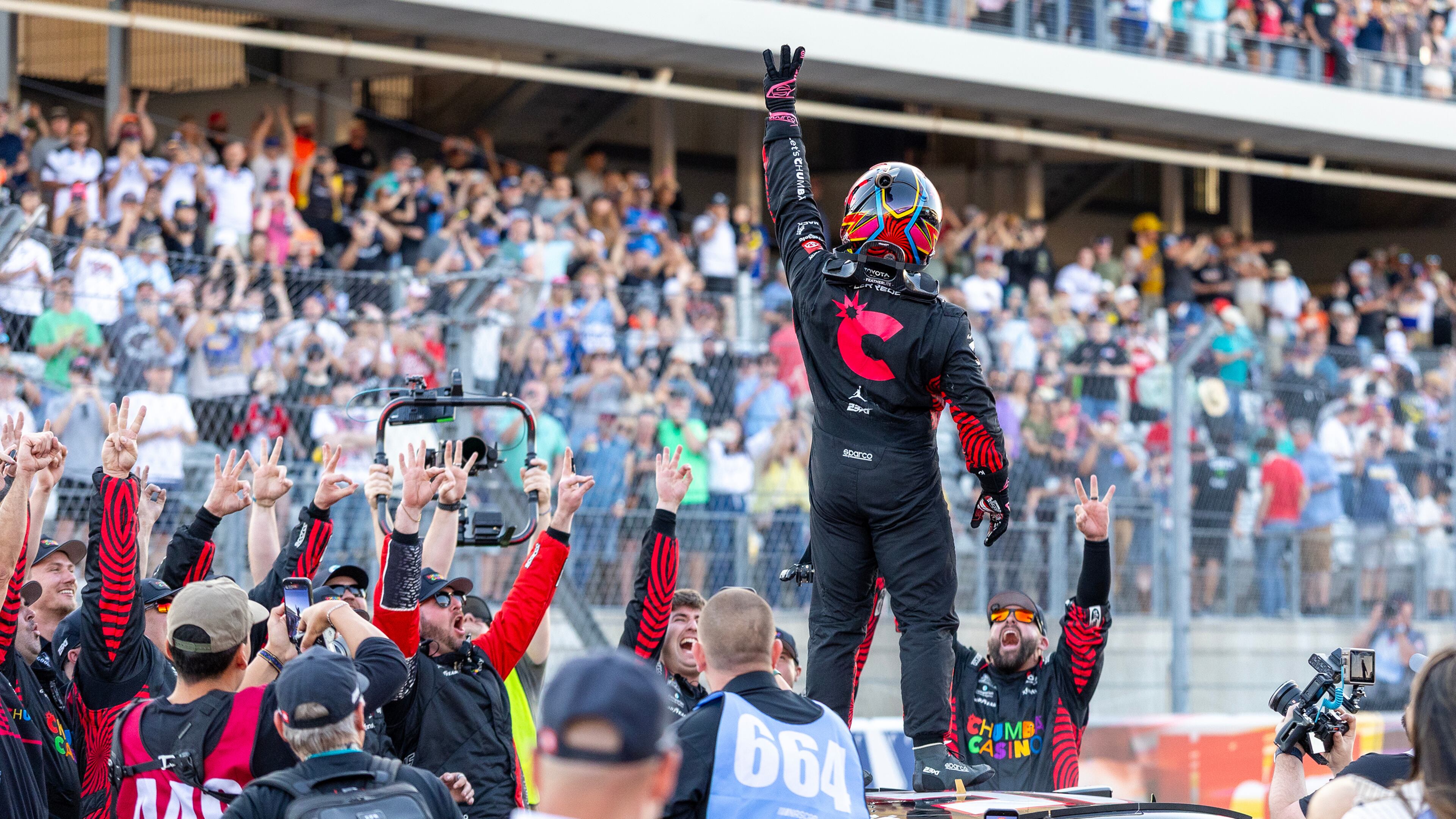 23XI Racing's Tyler Reddick, center, celebrates his win during a NASCAR Cup Series auto race in Austin, Texas, Sunday, March 1, 2026. (AP Photo/Stephen Spillman)