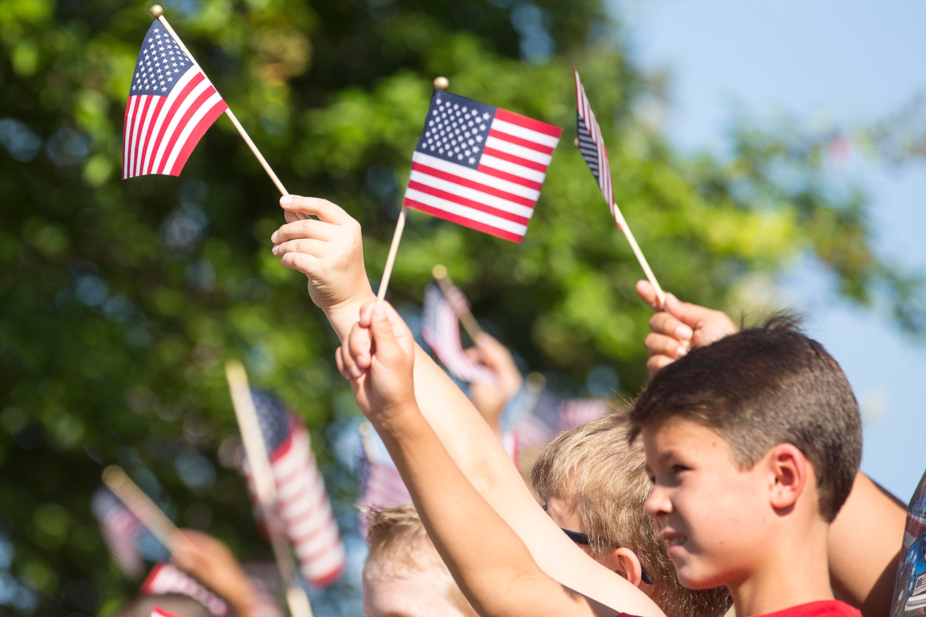 08/09/2018 -- Toccoa, Georgia -- Students from Toccoa Elementary School gather along Doyle Street during a hero's welcome for the remains of Korea War Veteran Cpl. Terrell J. Fuller in downtown Toccoa, Thursday, August 9, 2018. US Army Cpl. Terrell J. Fuller, who enlisted when he was 21-years-old, went missing in South Korea 67 years ago. Through DNA testing his remains were discovered. Thursday morning his remains landed at Hartsfield Jackson Airport and was escorted by police to his hometown of Toccoa Georgia. (ALYSSA POINTER/ALYSSA.POINTER@AJC.COM)