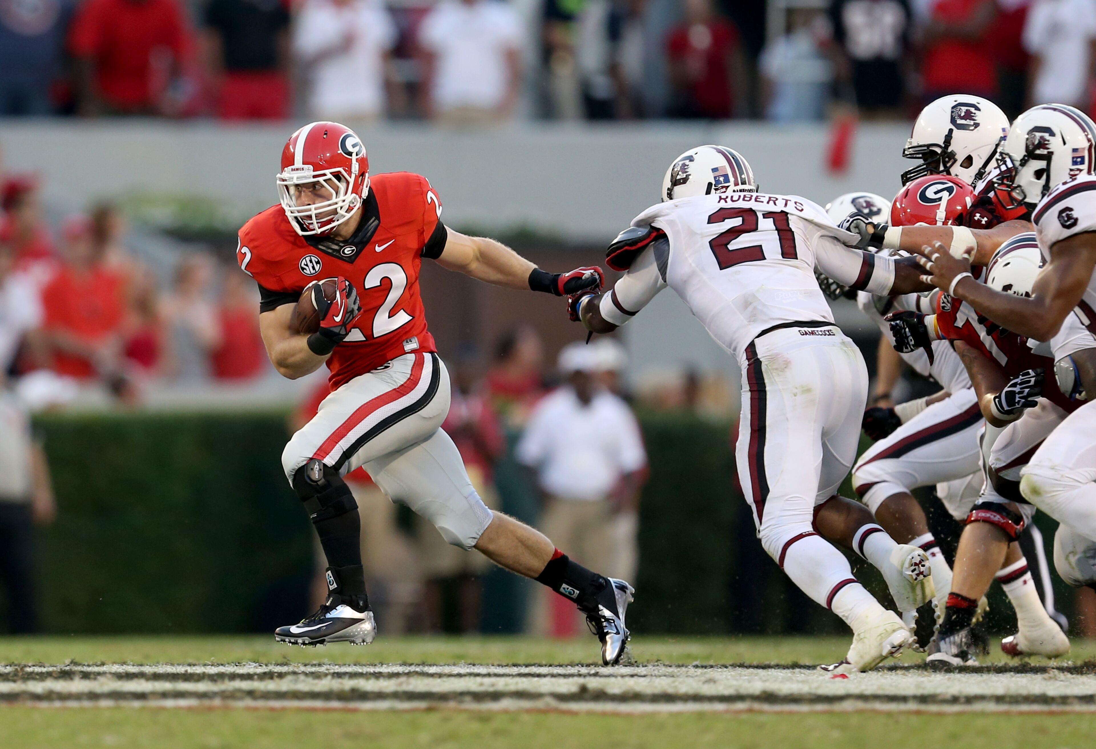 Brendan Douglas (22) gets away from the University of South Carolina defenders for a 17-yard run in the fourth quarter.