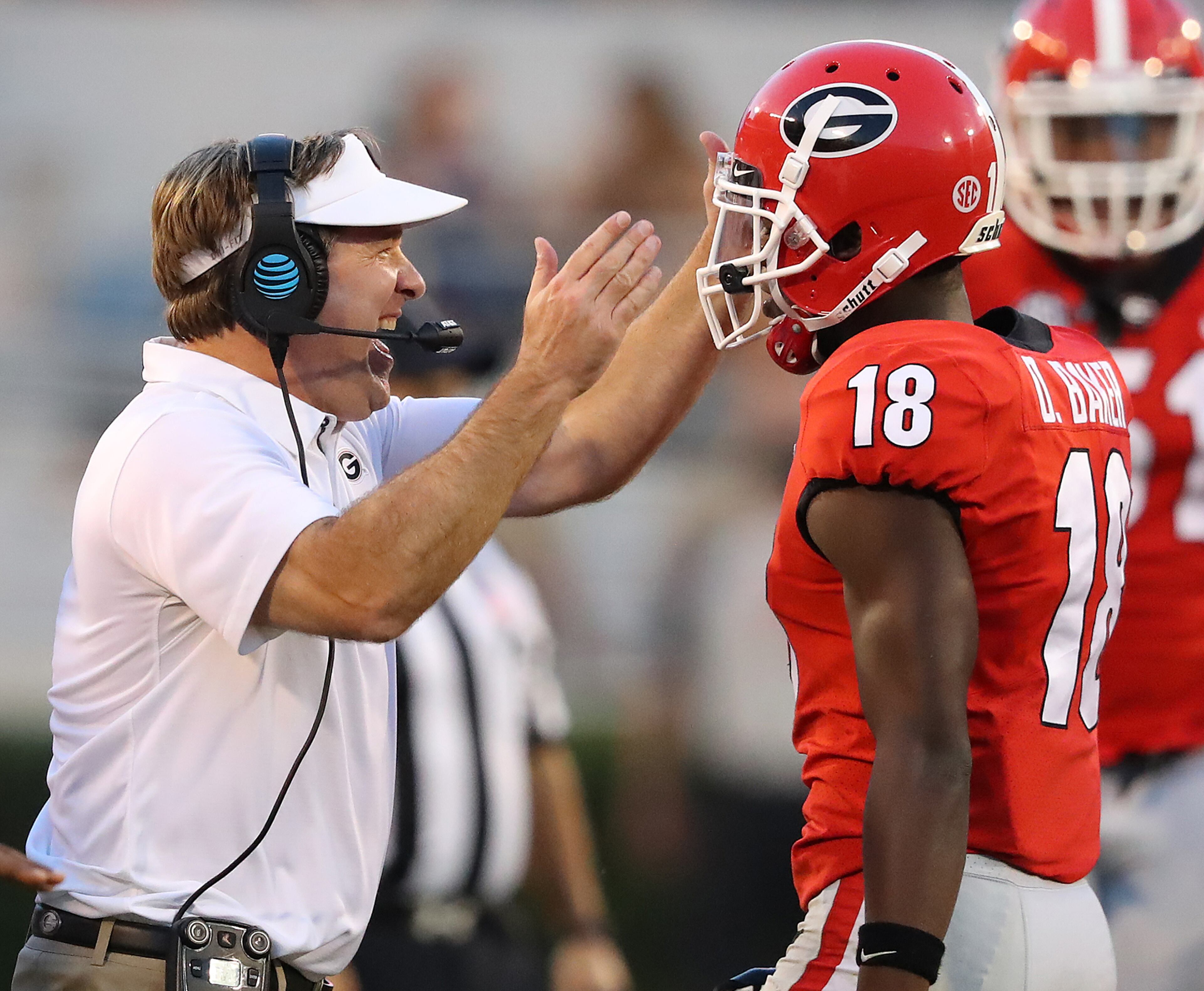 November 4, 2017 Athens: Georgia head coach Kirby Smart gives defensive back Deandre Baker a double pat on the helmet after he stopped South Carolina on a fourth down play to take over on downs during the fourth quarter in a NCAA college football game on Saturday, November 4, 2017, in Athens. Curtis Compton/ccompton@ajc.com