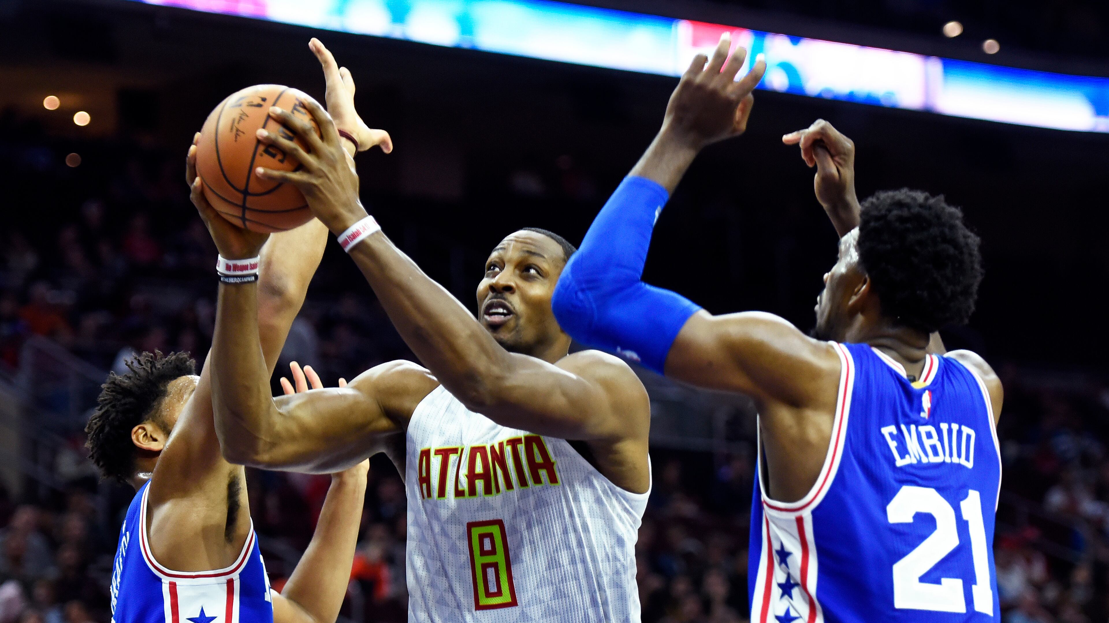 Atlanta Hawks’ Dwight Howard (8) drives to the basket past Philadelphia 76ers’ Joel Embiid (21) and Jahlil Okafor during the first half of an NBA basketball game, Saturday, Oct. 29, 2016, in Philadelphia. (AP Photo/Michael Perez)