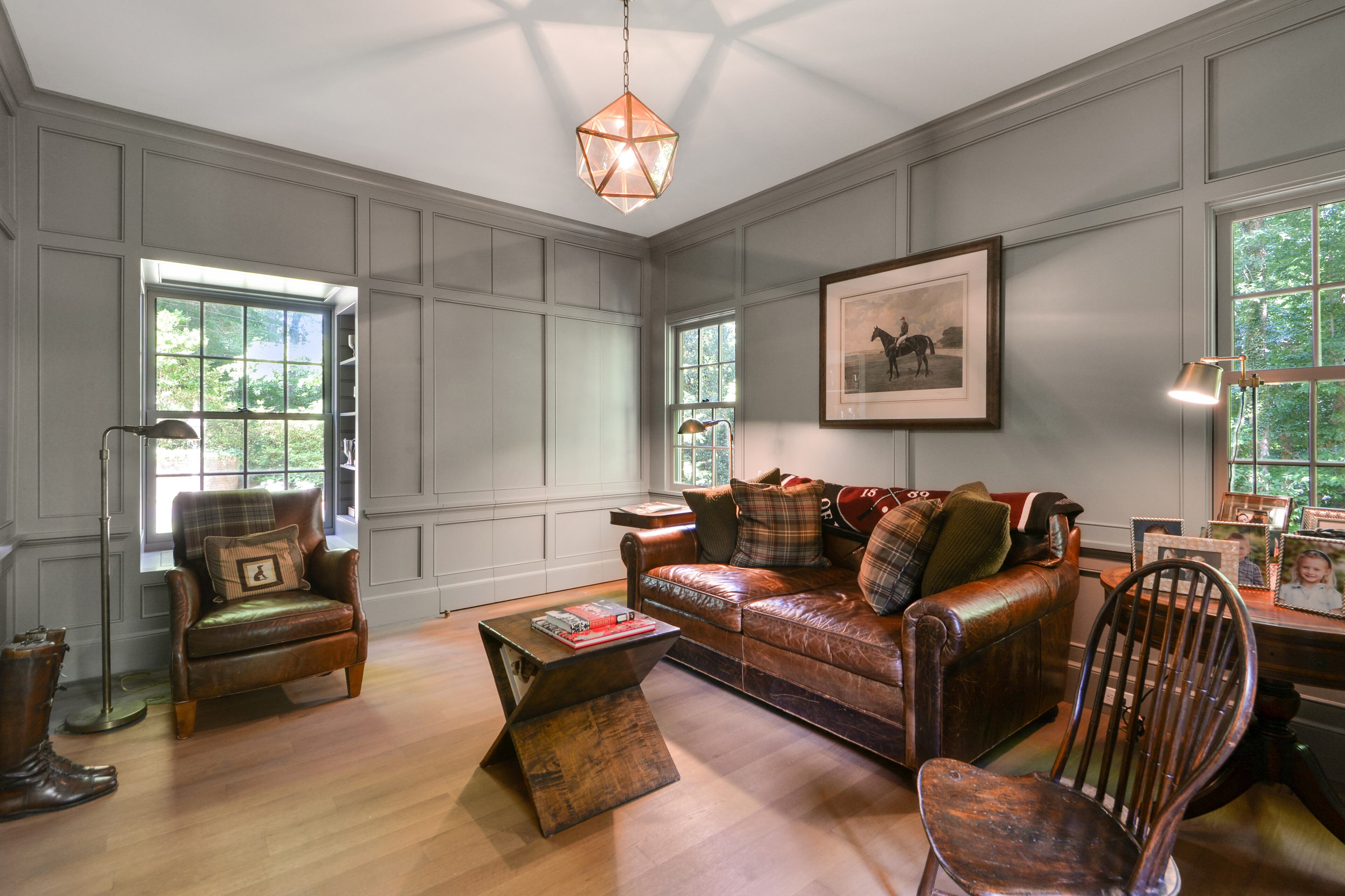 The handsome English paneled library offers a stylish place to work and relax. Text by Bryan Peterson
