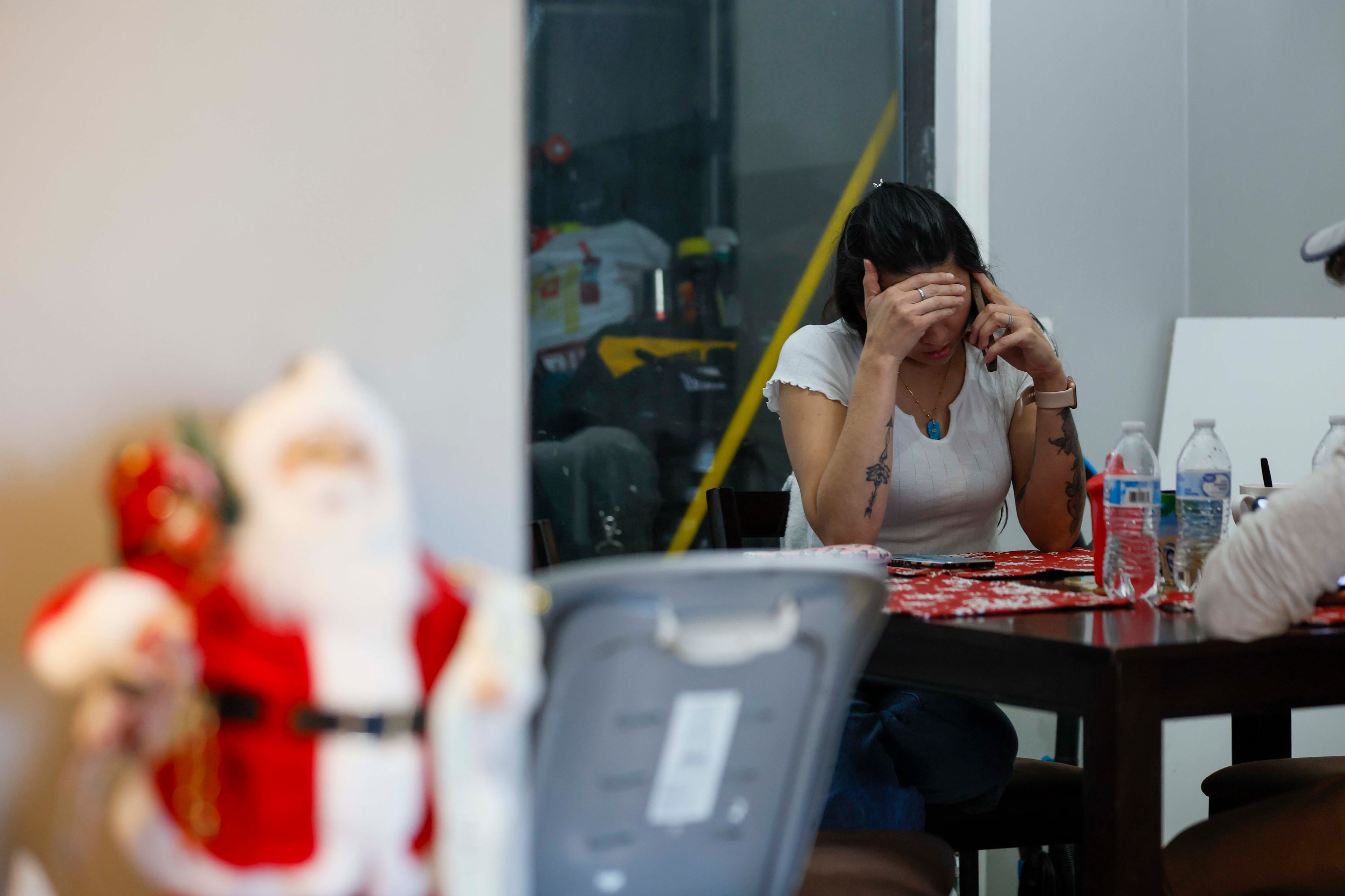 Ceudy Gutierrez has been struggling financially to care for herself and her three children after immigration officials detained her husband in September. (Miguel Martinez/AJC)